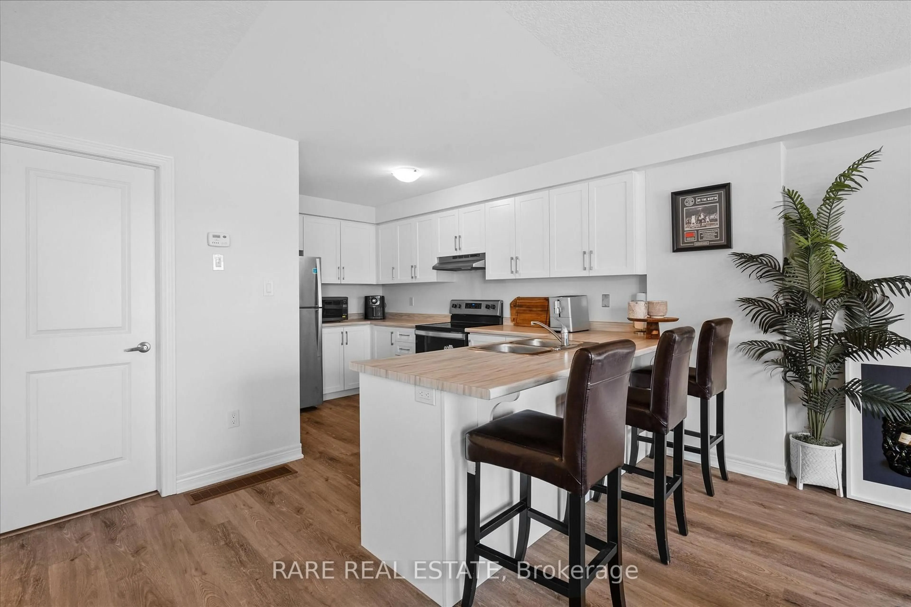 Open concept kitchen, wood/laminate floor for 112 Dryden Lane, Hamilton Ontario L8H 1L9