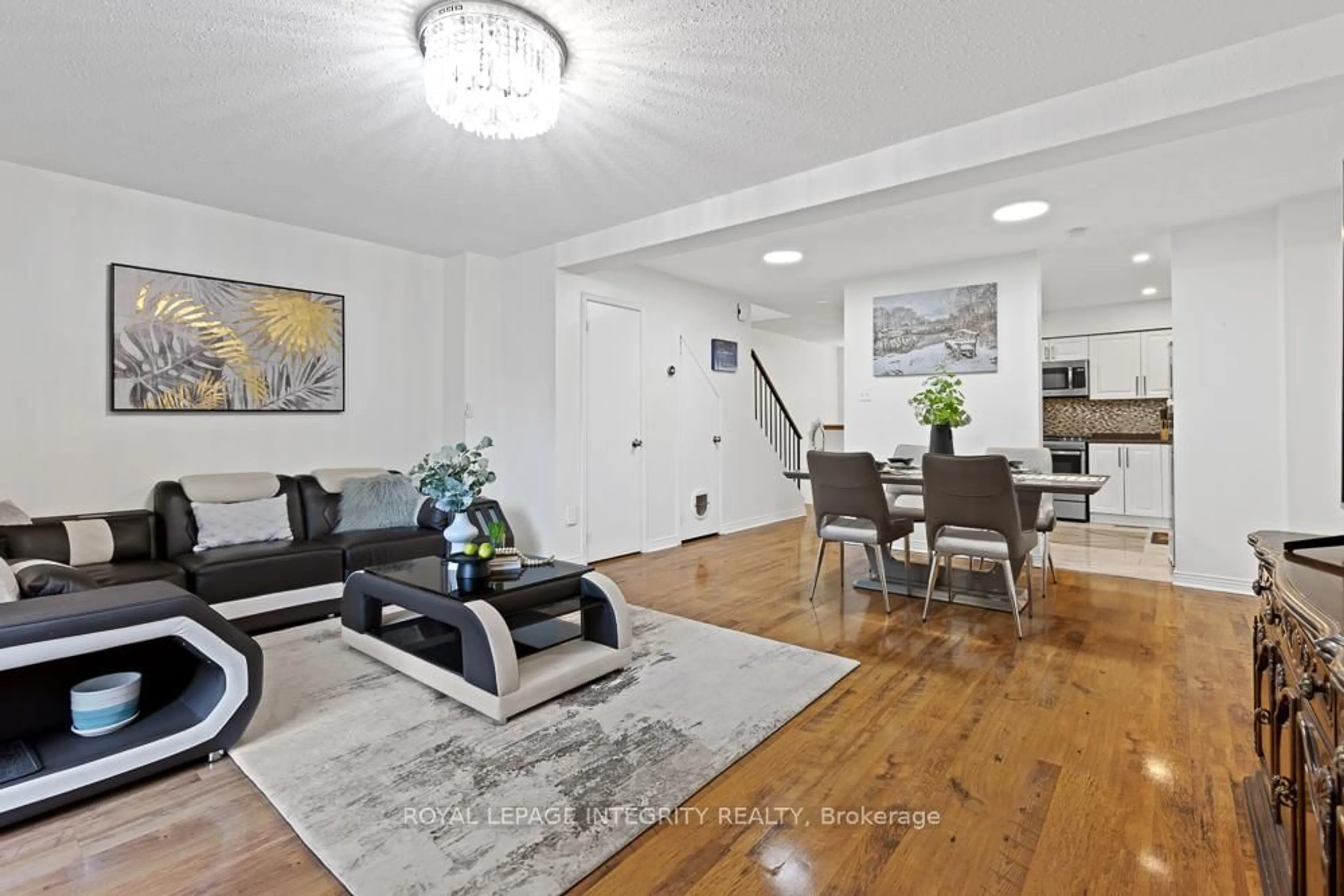 Living room with furniture, wood/laminate floor for 498 Sandhamn Private, Ottawa Ontario K1T 2Z6