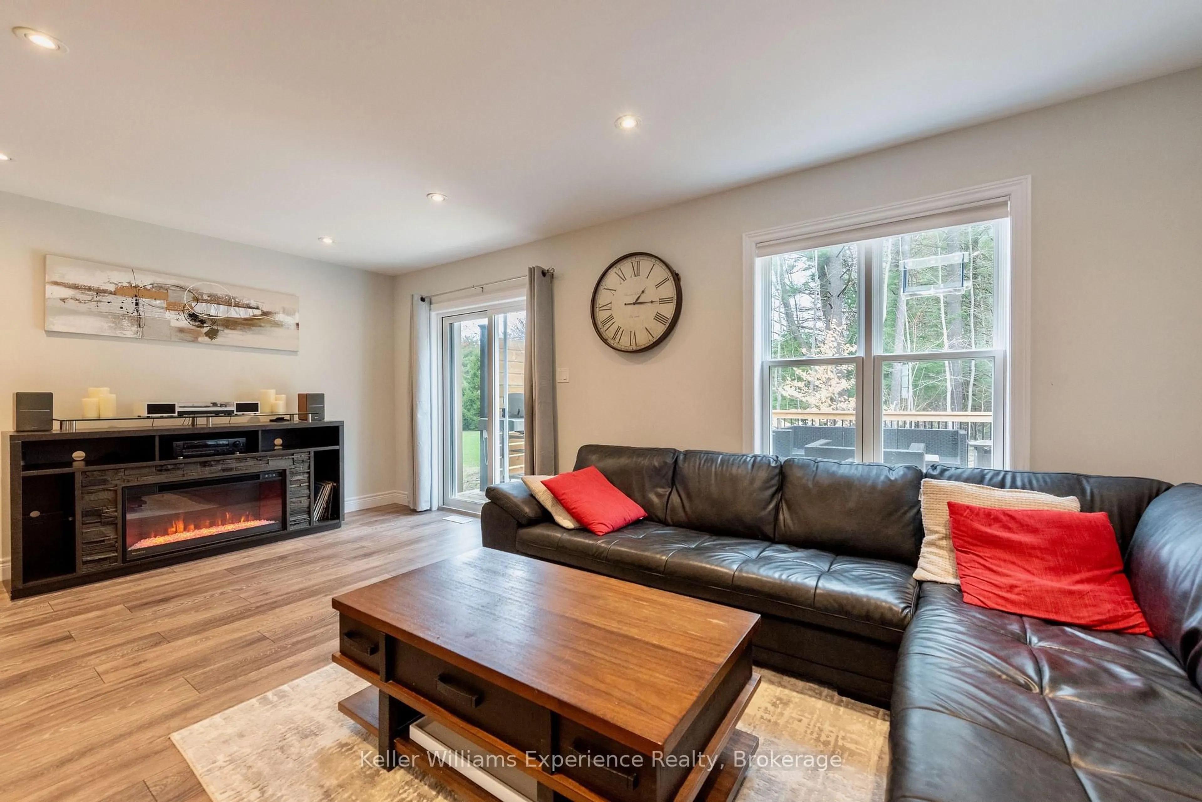 Living room with furniture, wood/laminate floor for 31 Nicole Park Crt, Bracebridge Ontario P1L 0C8