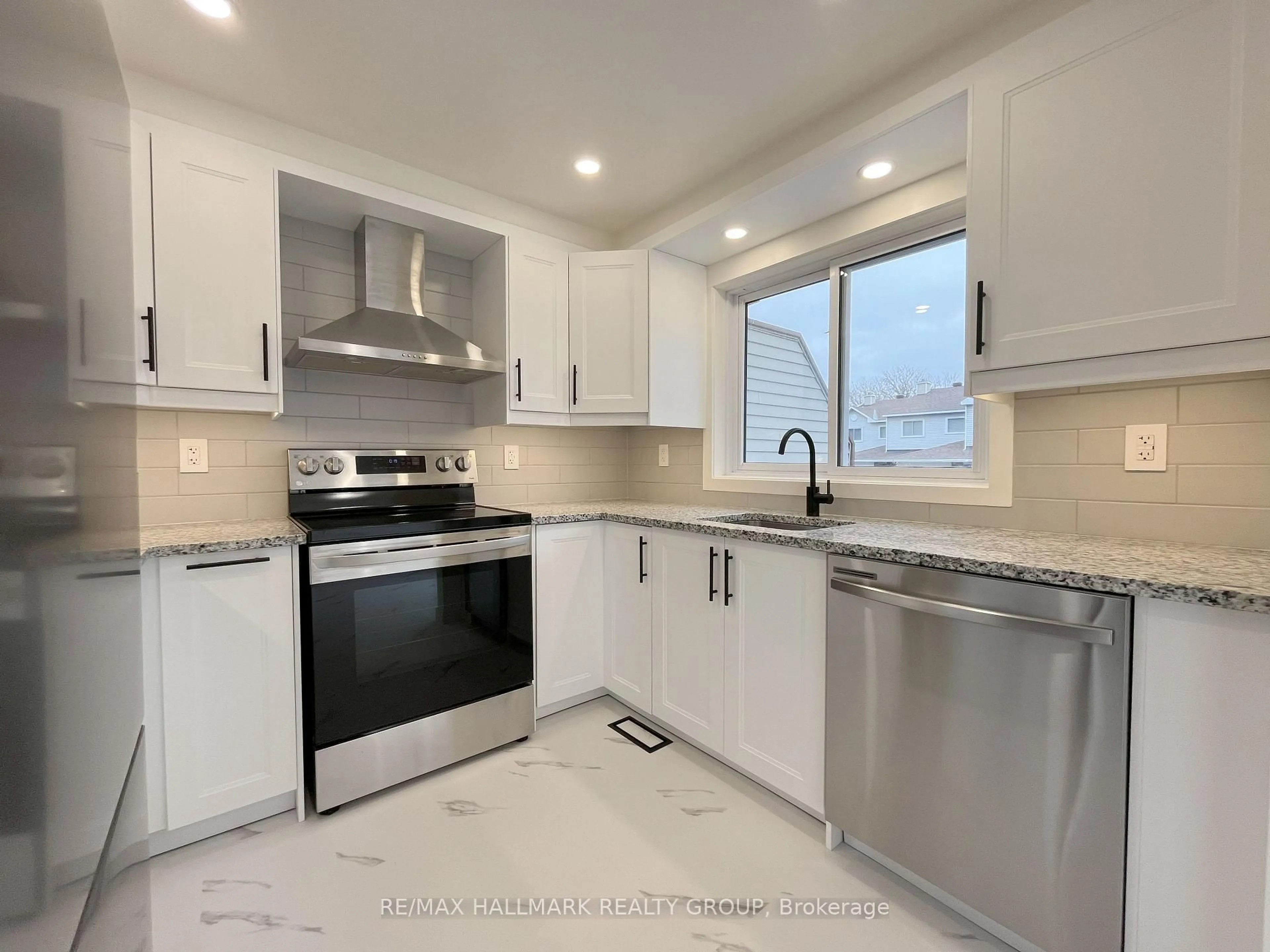 Open concept kitchen, ceramic/tile floor for 94 Esterlawn Private #11, Ottawa Ontario K2A 4C1