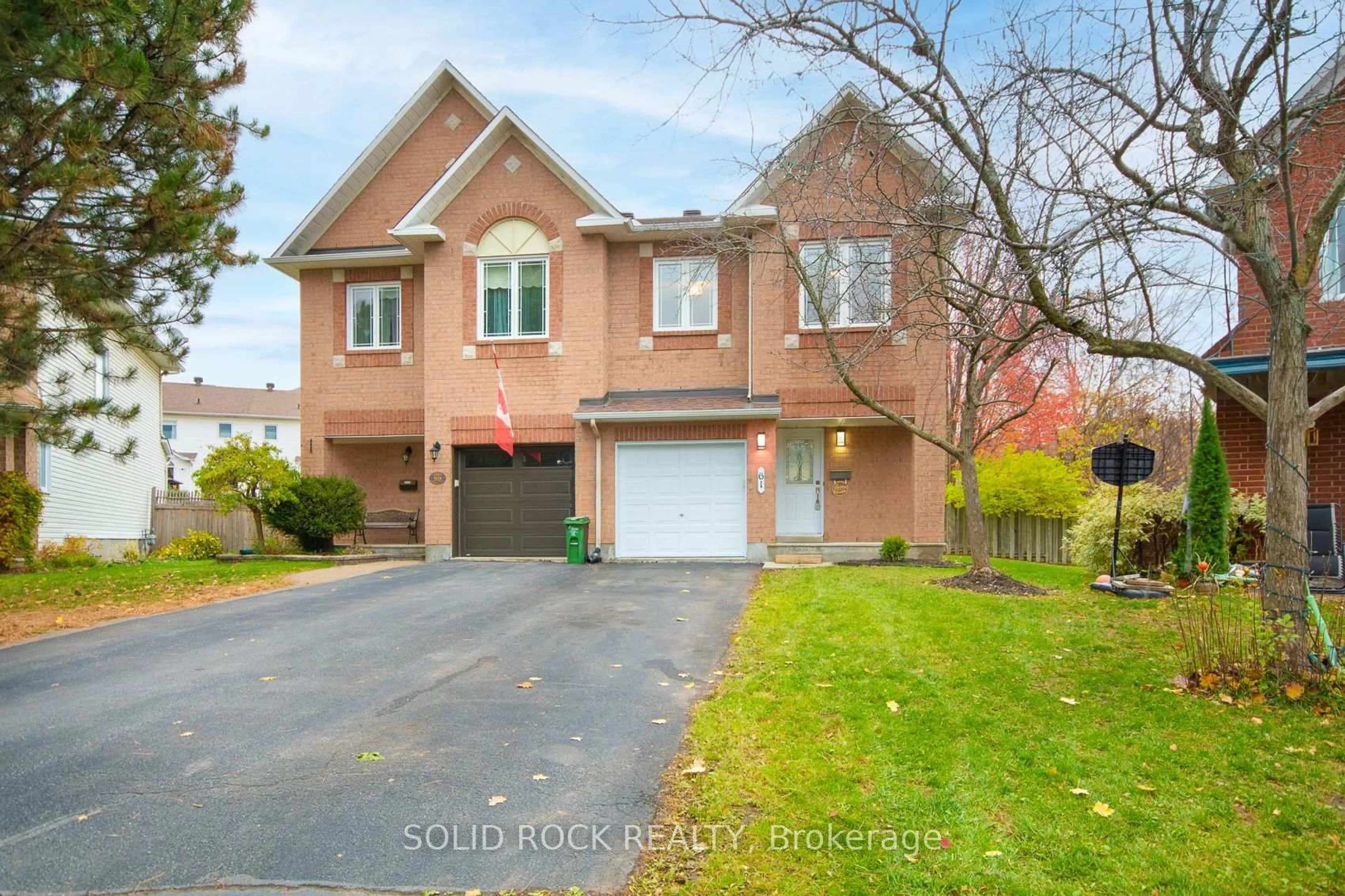 Home with brick exterior material, street for 61 Flowertree Cres, Ottawa Ontario K2M 2R7