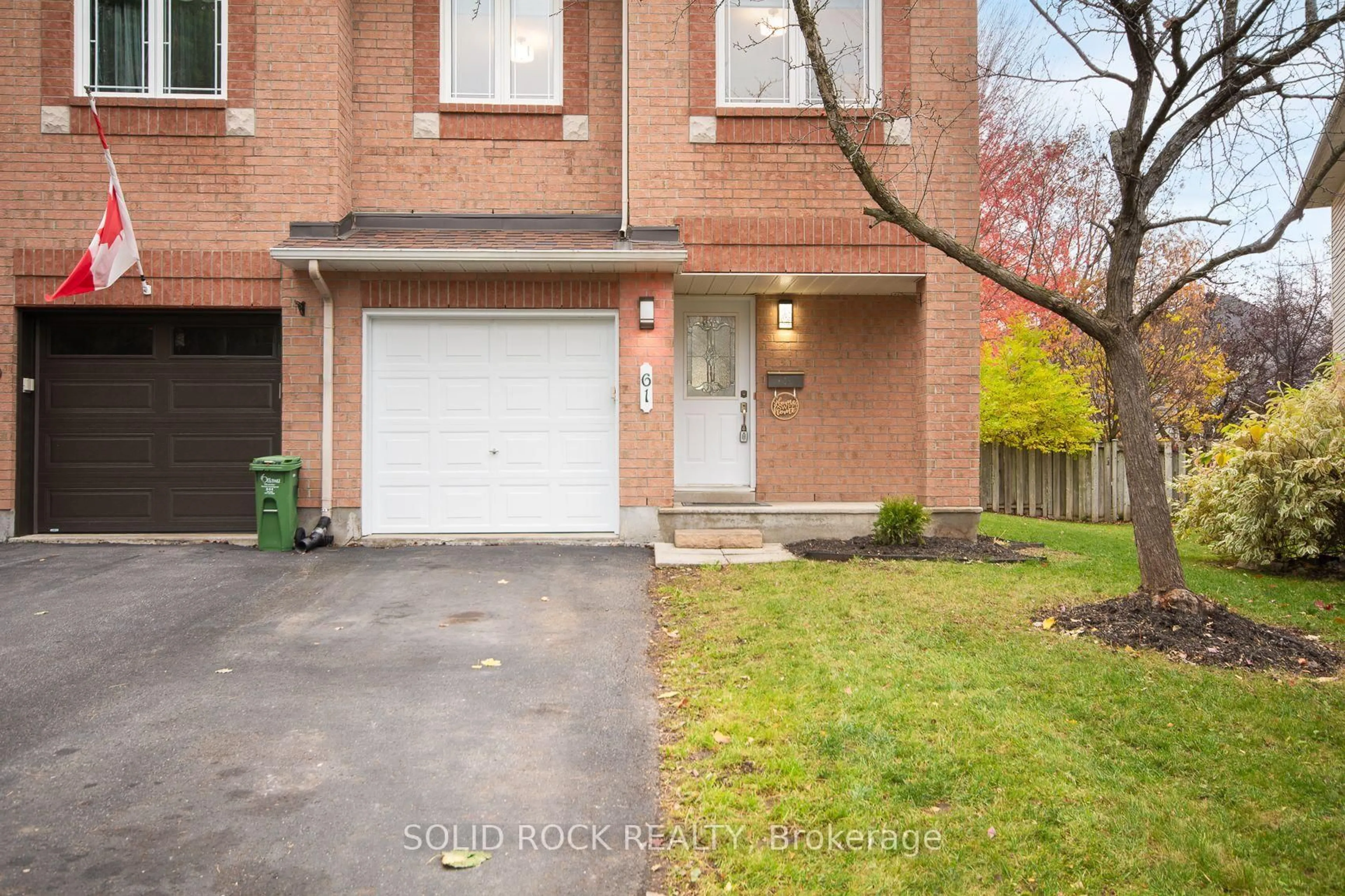 Home with brick exterior material, street for 61 Flowertree Cres, Ottawa Ontario K2M 2R7