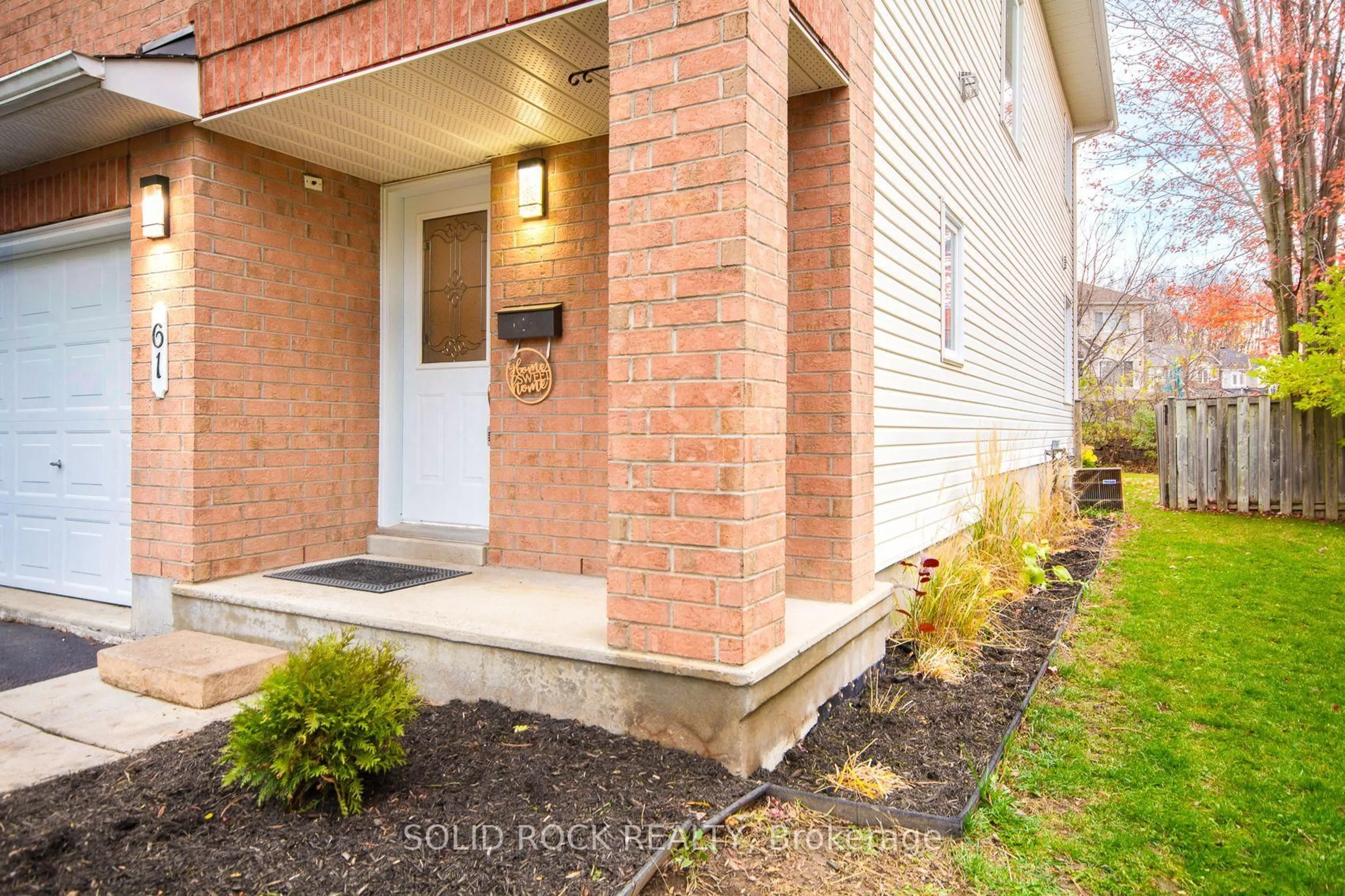 Home with brick exterior material, street for 61 Flowertree Cres, Ottawa Ontario K2M 2R7