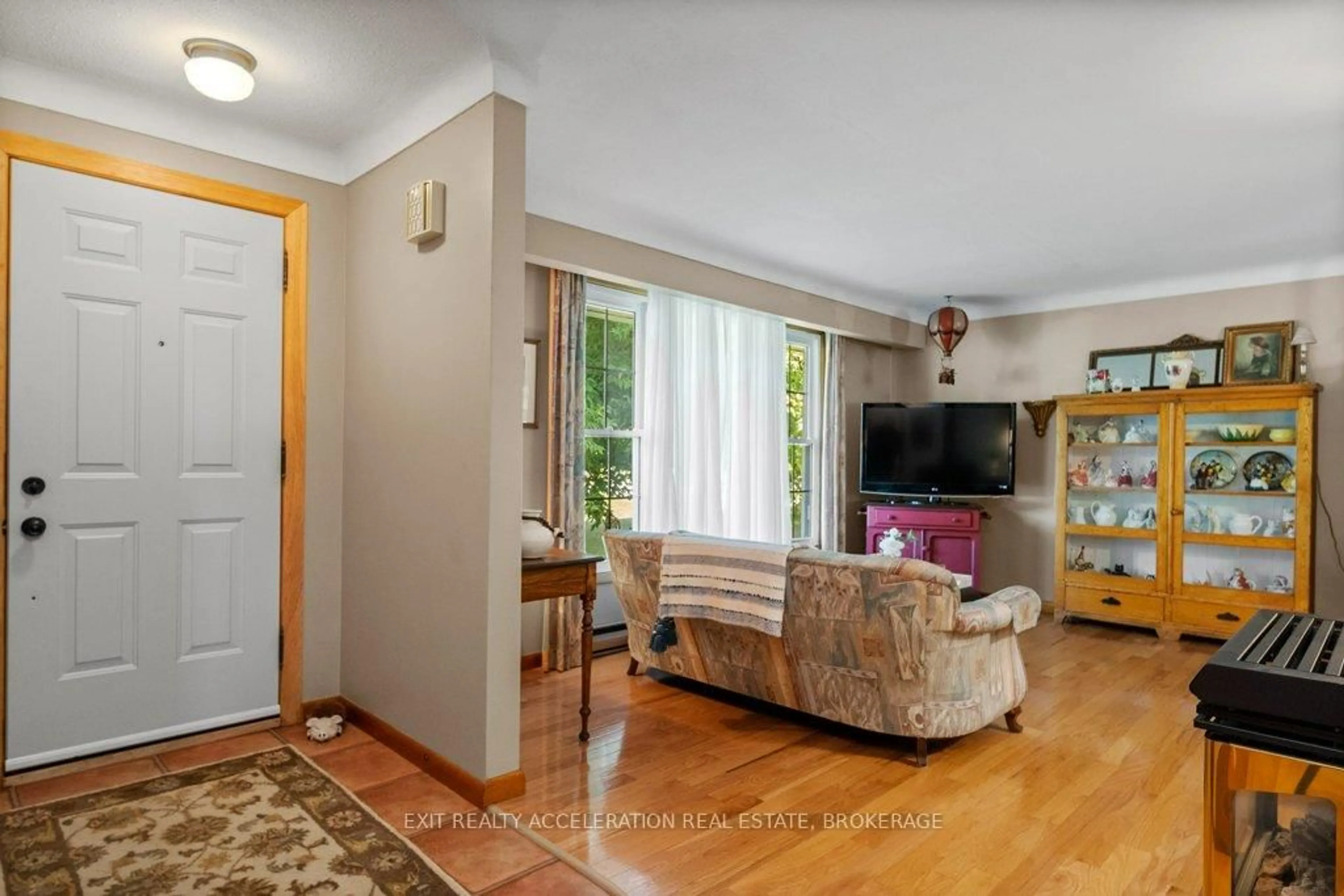 Living room with furniture, wood/laminate floor for 63 River Rd, Greater Napanee Ontario K7R 3H3