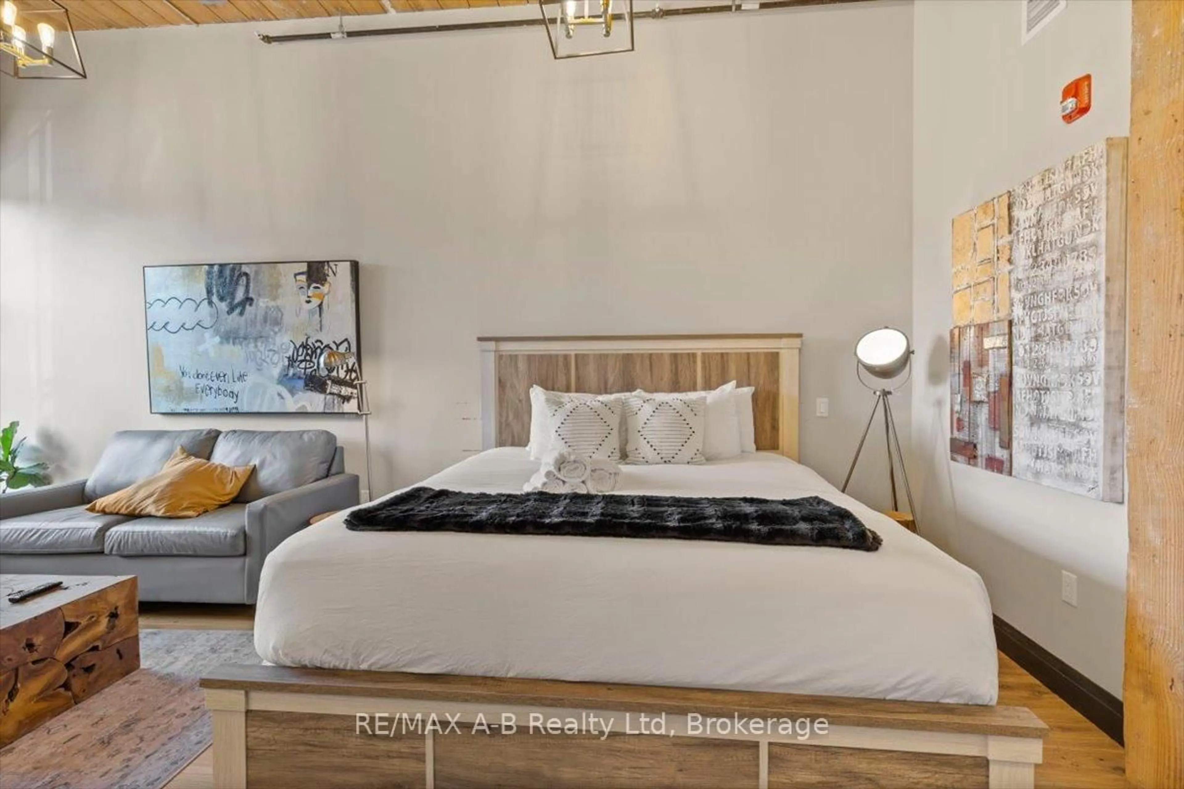 Bedroom with bed, wood/laminate floor for 245 DOWNIE St #112, Stratford Ontario N5A 1X2