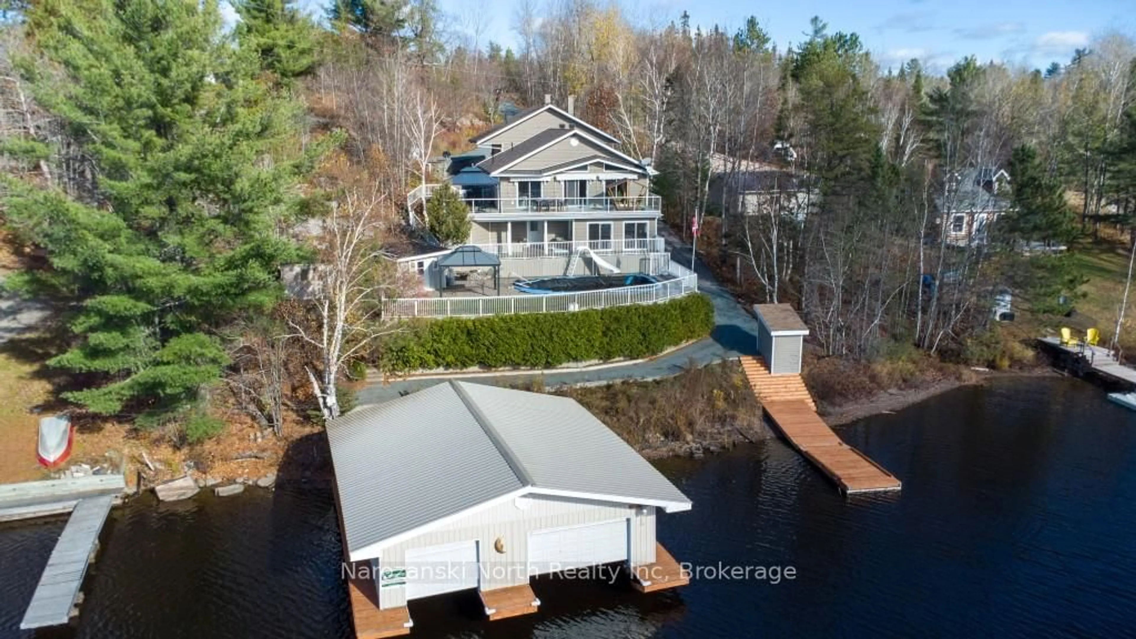 A pic from outside/outdoor area/front of a property/back of a property/a pic from drone, water/lake/river/ocean view for 56 Island Rd, St. Charles Ontario P0M 2W0