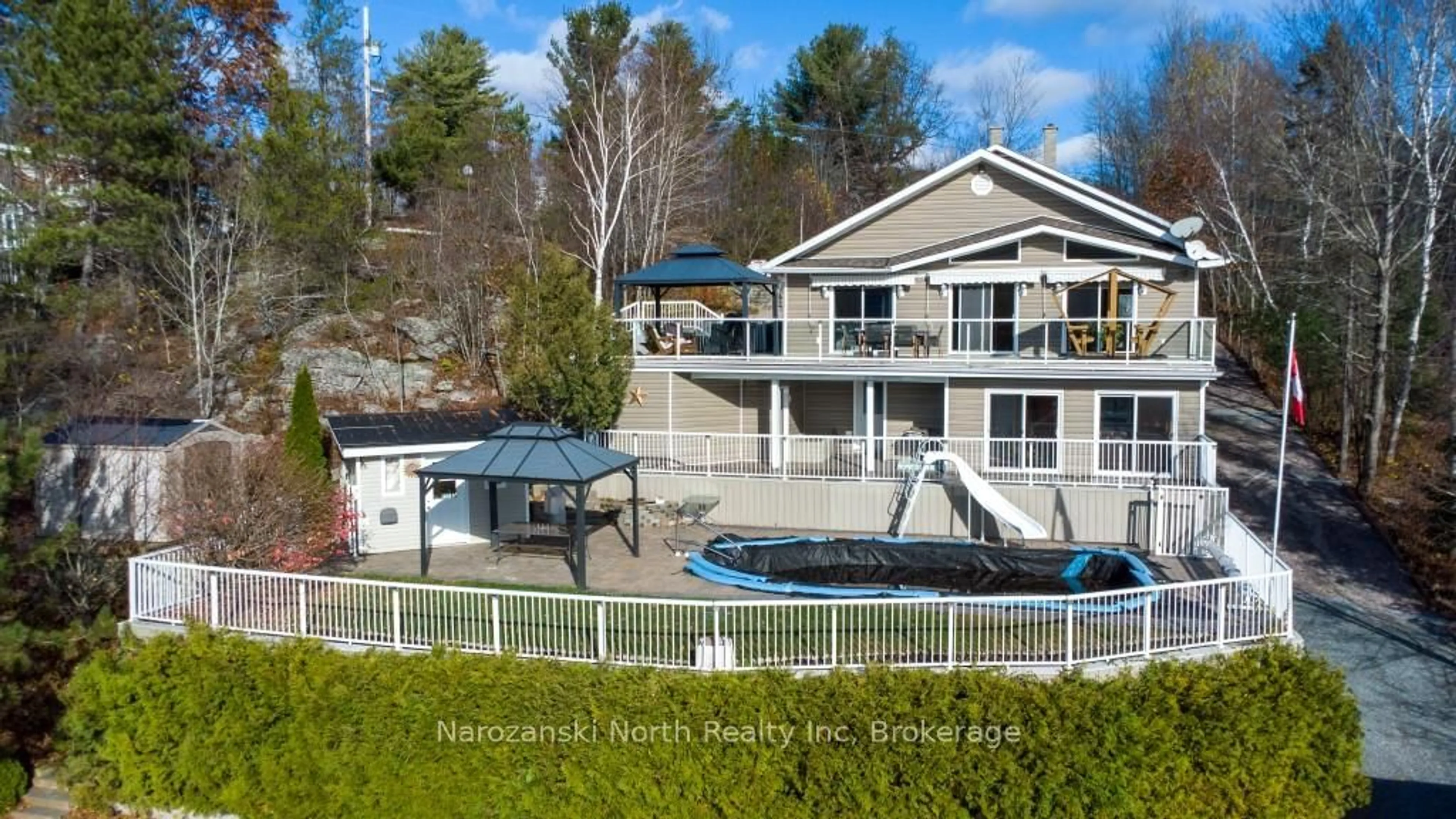 A pic from outside/outdoor area/front of a property/back of a property/a pic from drone, water/lake/river/ocean view for 56 Island Rd, St. Charles Ontario P0M 2W0