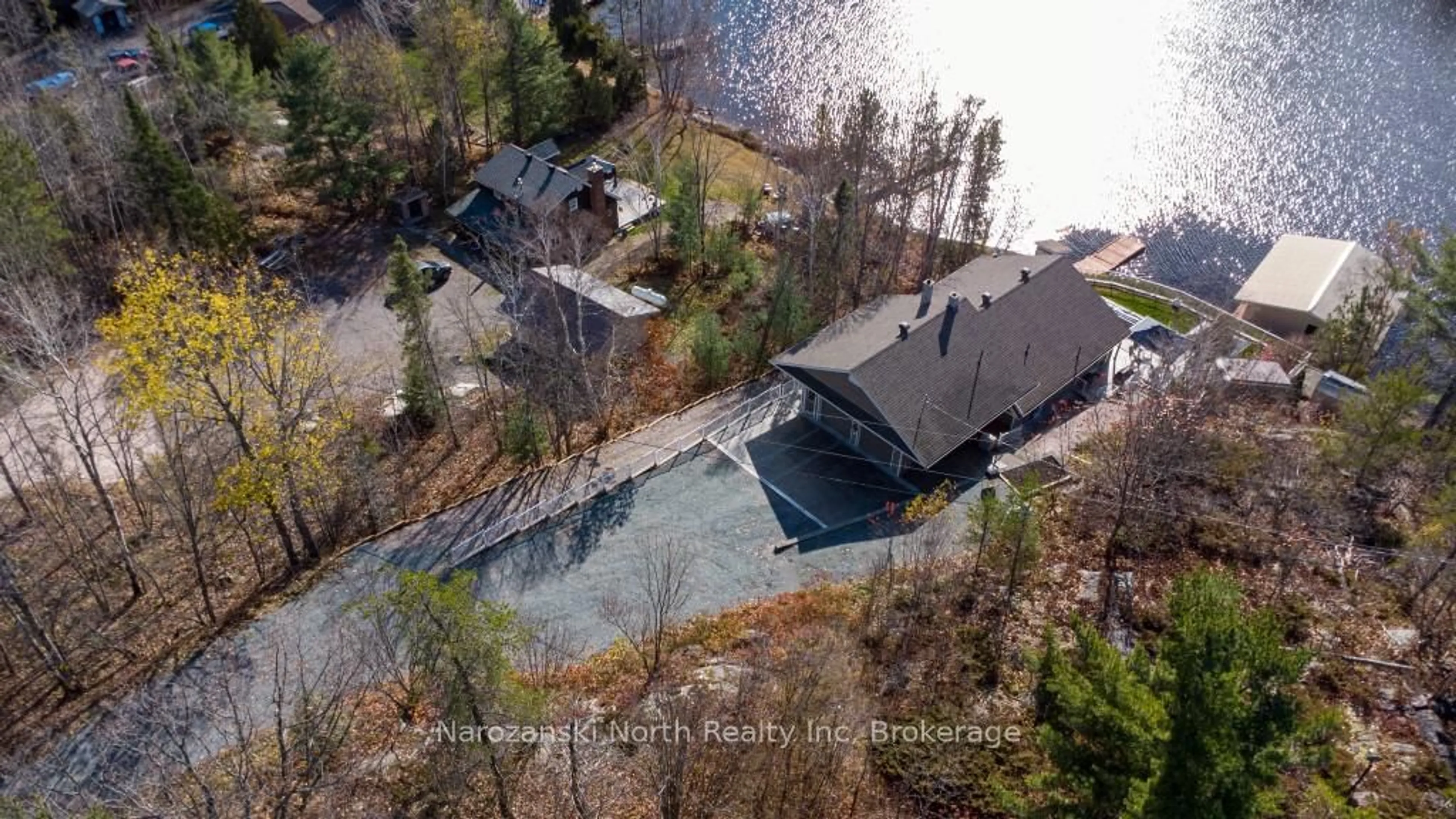 A pic from outside/outdoor area/front of a property/back of a property/a pic from drone, water/lake/river/ocean view for 56 Island Rd, St. Charles Ontario P0M 2W0
