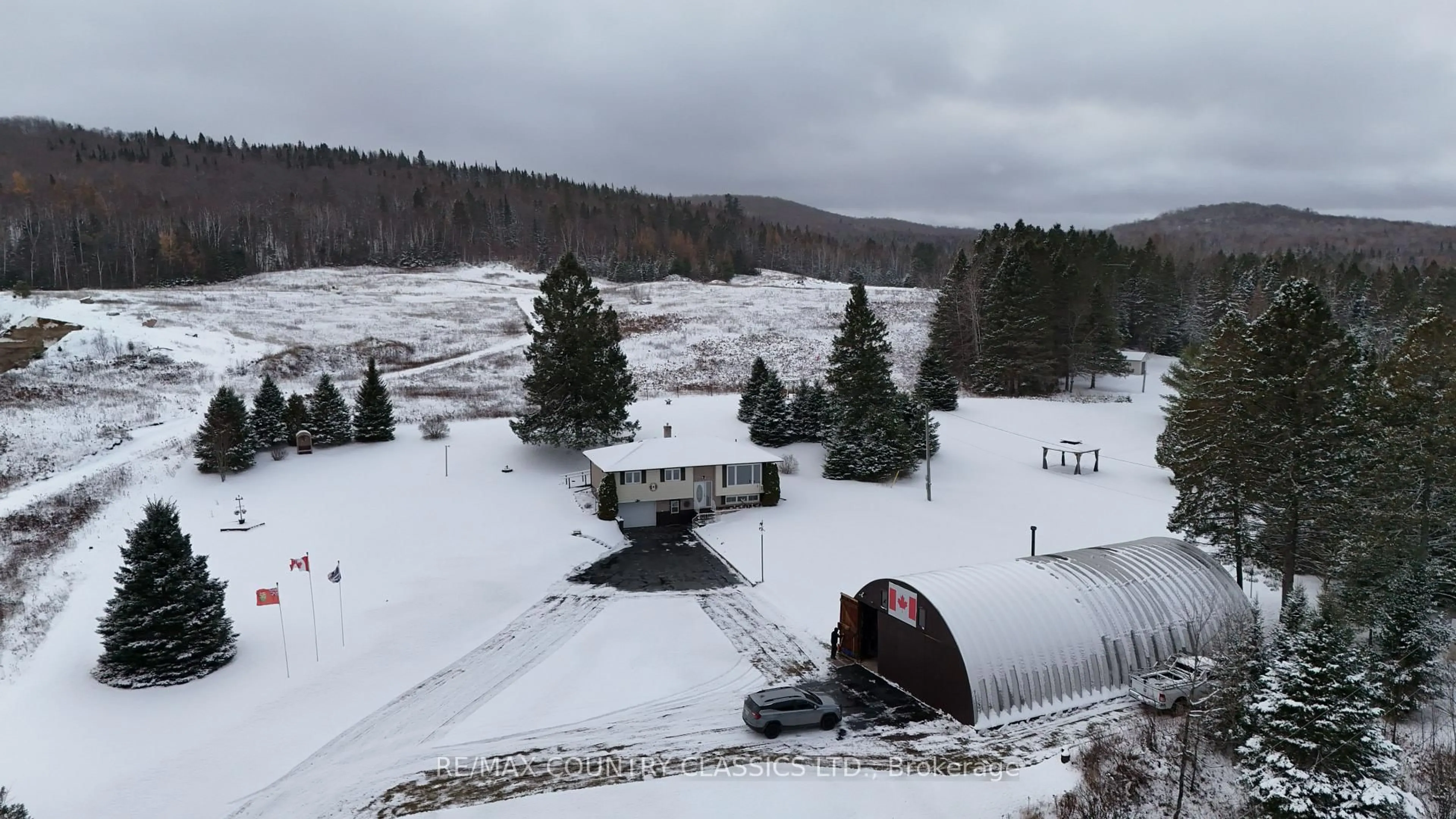 A pic from outside/outdoor area/front of a property/back of a property/a pic from drone, mountain view for 3559 South Baptiste Lake Rd, Highlands East Ontario K0L 2A0