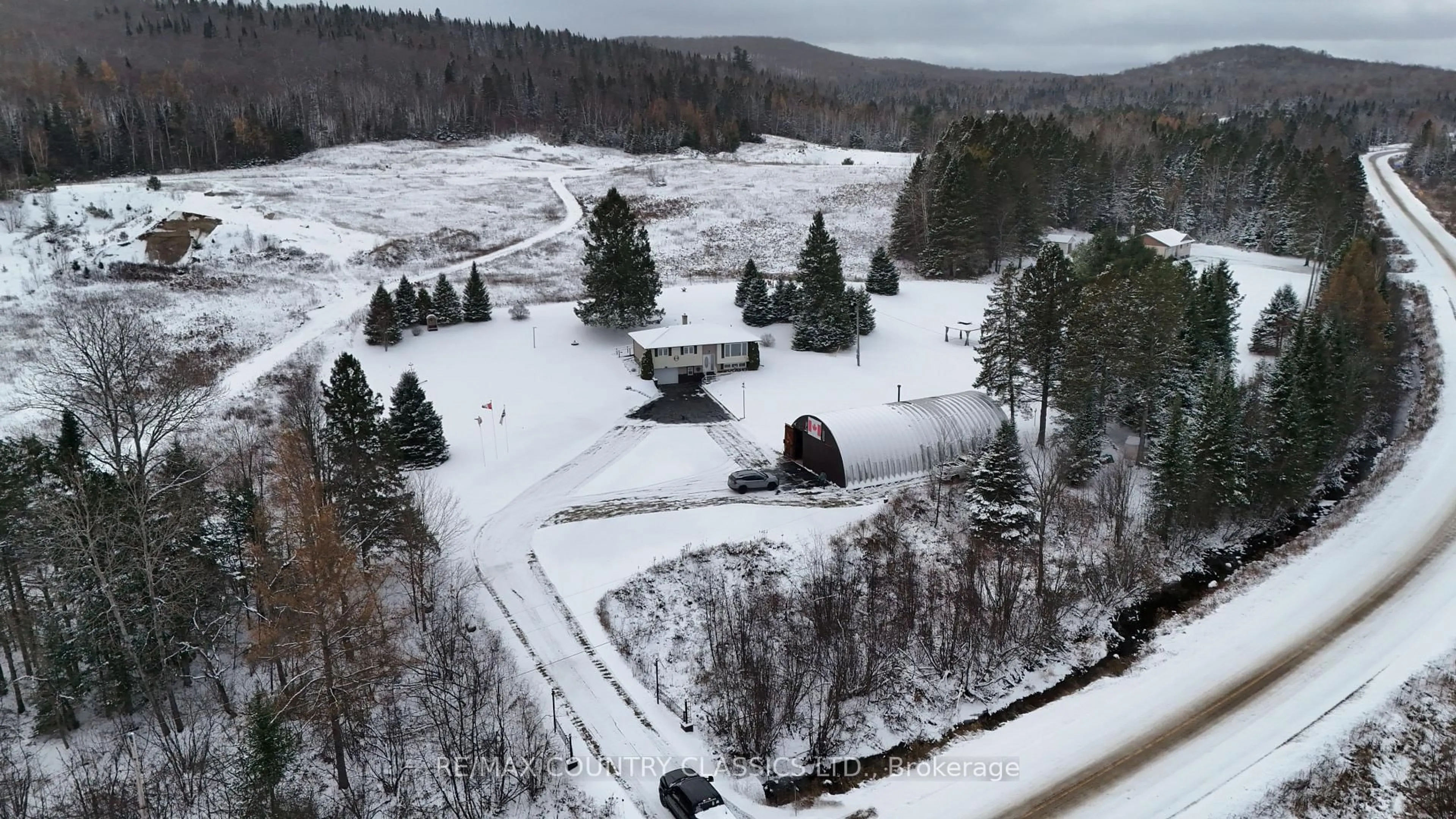 A pic from outside/outdoor area/front of a property/back of a property/a pic from drone, mountain view for 3559 South Baptiste Lake Rd, Highlands East Ontario K0L 2A0