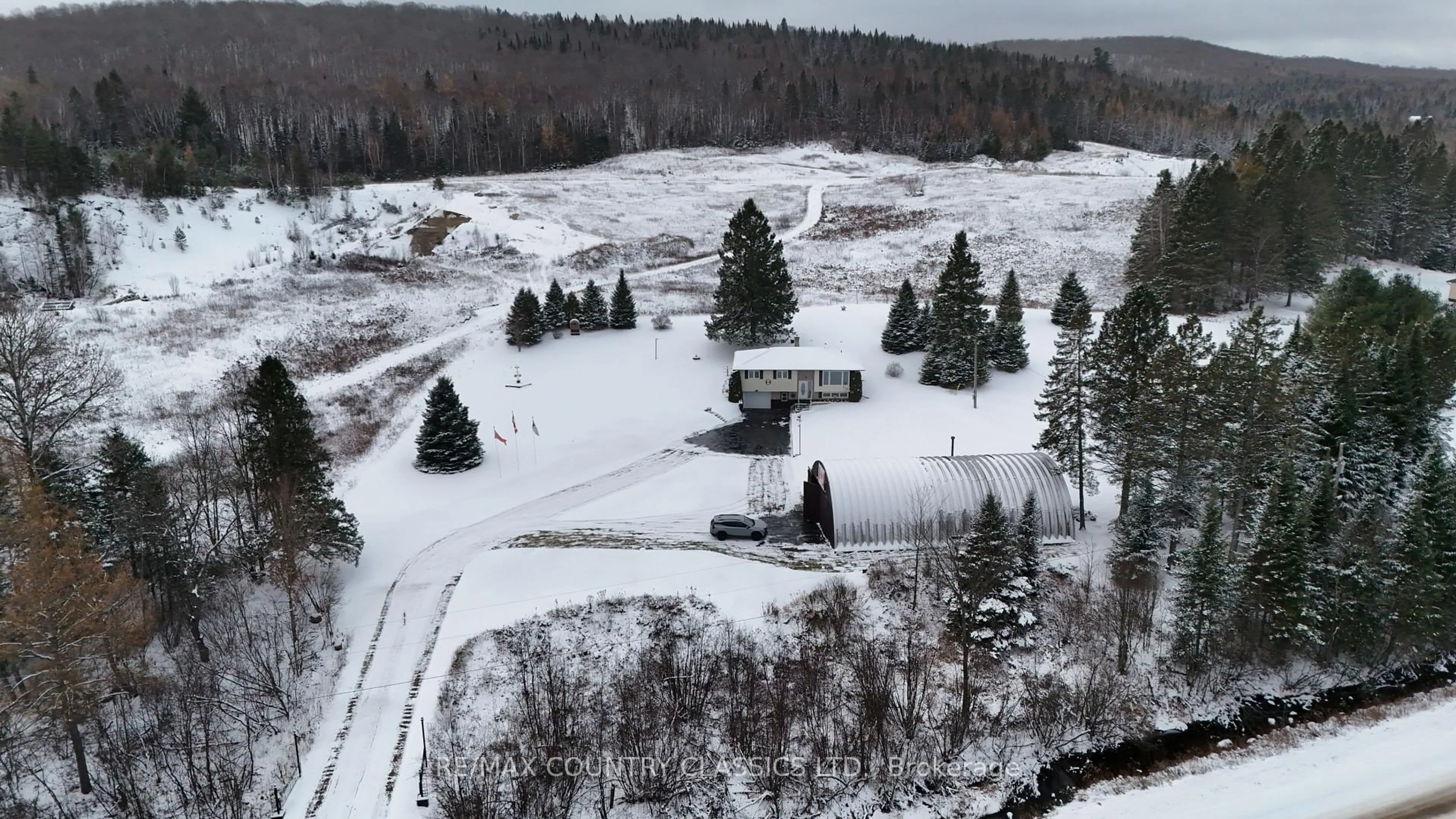 A pic from outside/outdoor area/front of a property/back of a property/a pic from drone, forest/trees view for 3559 South Baptiste Lake Rd, Highlands East Ontario K0L 2A0