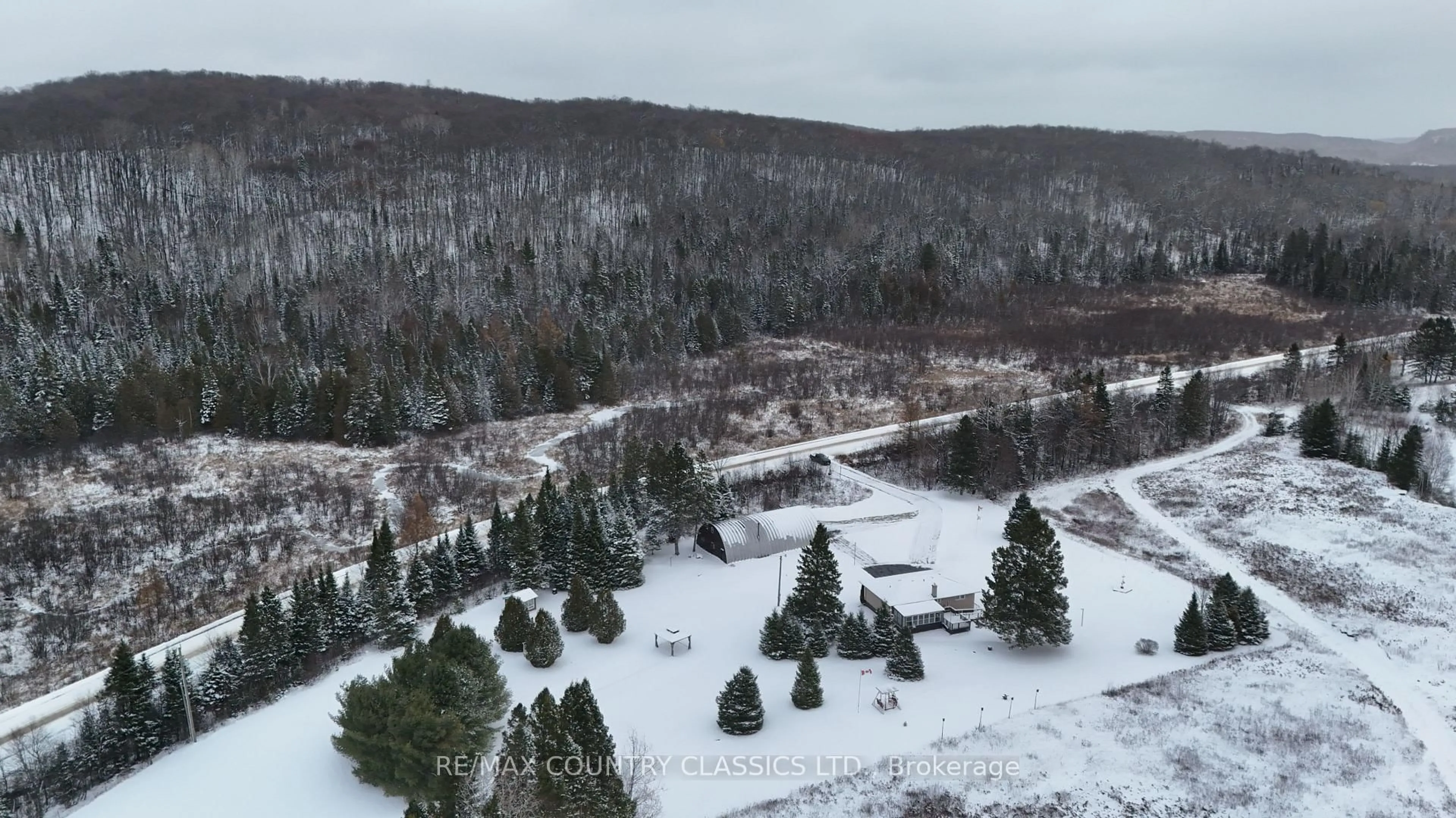A pic from outside/outdoor area/front of a property/back of a property/a pic from drone, forest/trees view for 3559 South Baptiste Lake Rd, Highlands East Ontario K0L 2A0