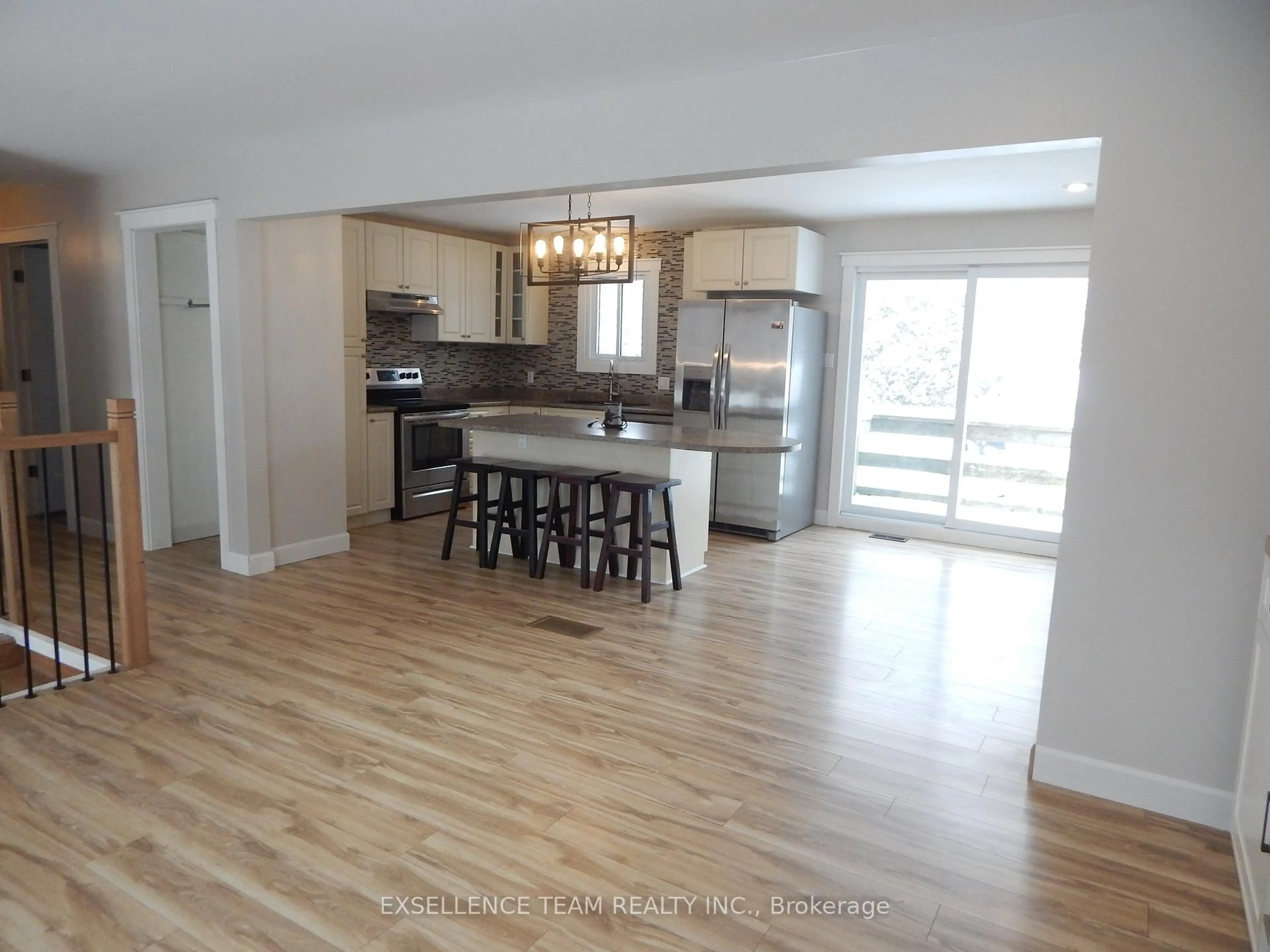 Open concept kitchen, wood/laminate floor for 17015 Chevrier St, North Stormont Ontario K0C 1V0