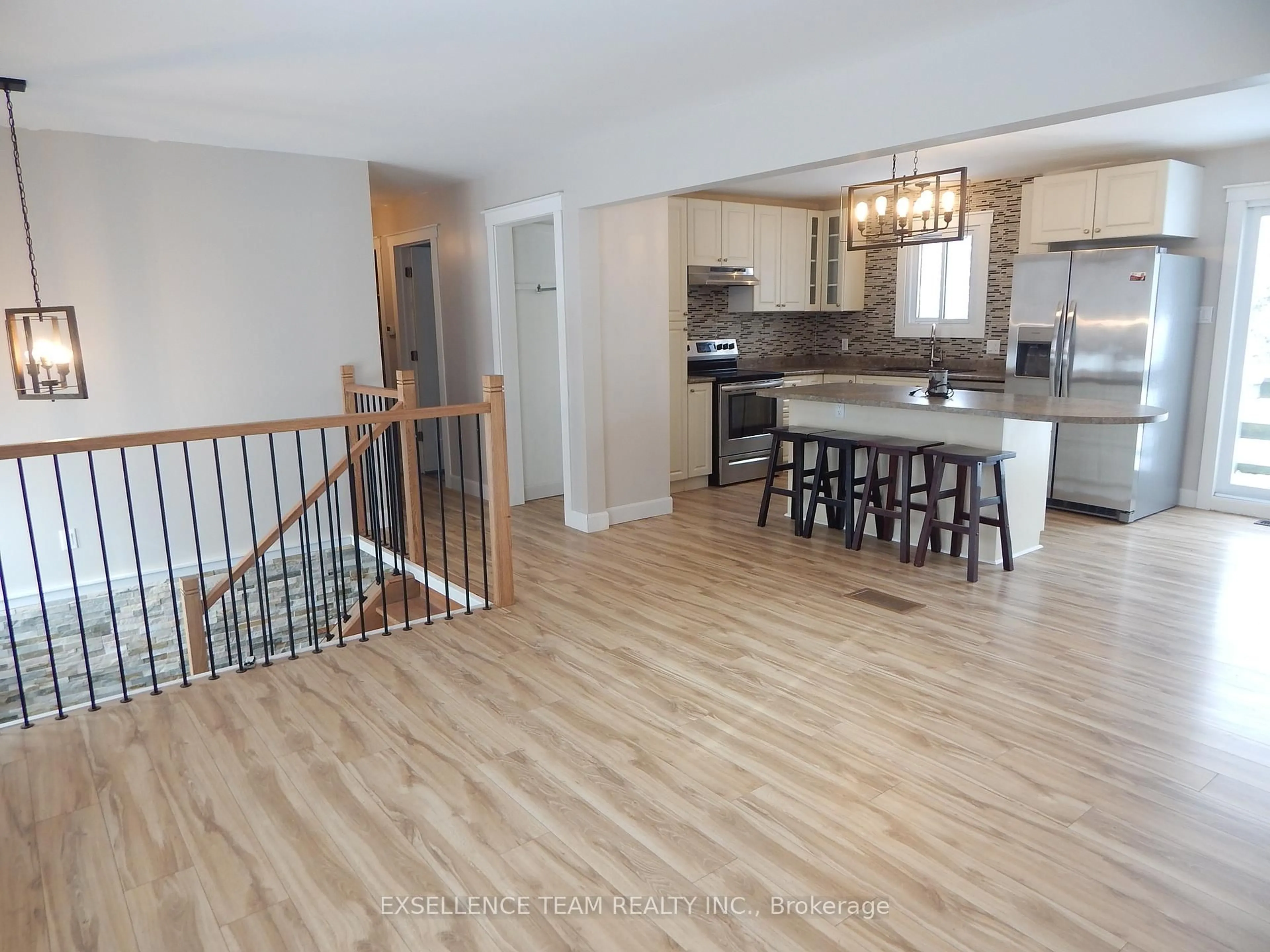 Open concept kitchen, wood/laminate floor for 17015 Chevrier St, North Stormont Ontario K0C 1V0