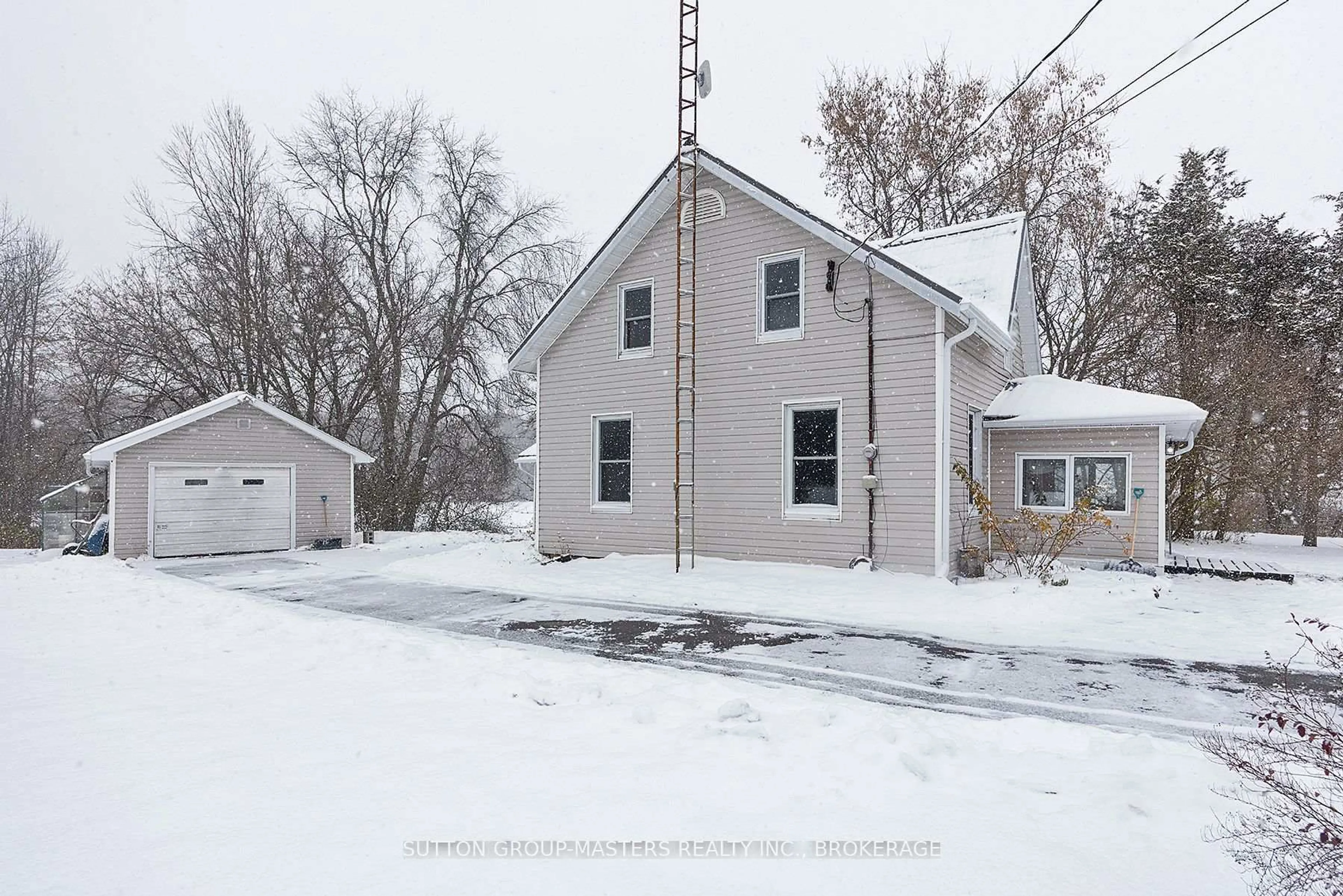 A pic from outside/outdoor area/front of a property/back of a property/a pic from drone, street for 3481 Wilton Rd, Harrowsmith Ontario K0H 1V0