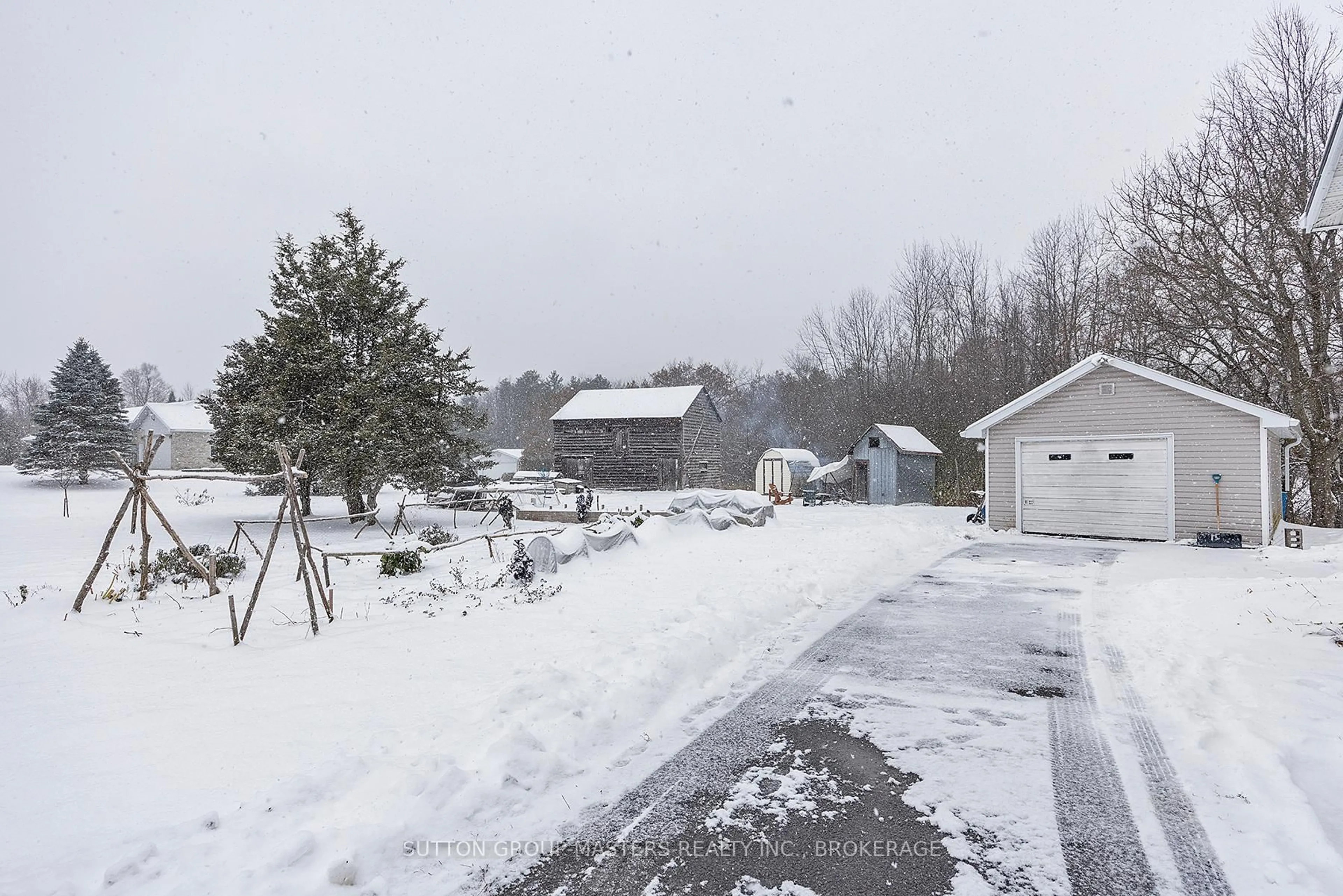 A pic from outside/outdoor area/front of a property/back of a property/a pic from drone, street for 3481 Wilton Rd, Harrowsmith Ontario K0H 1V0