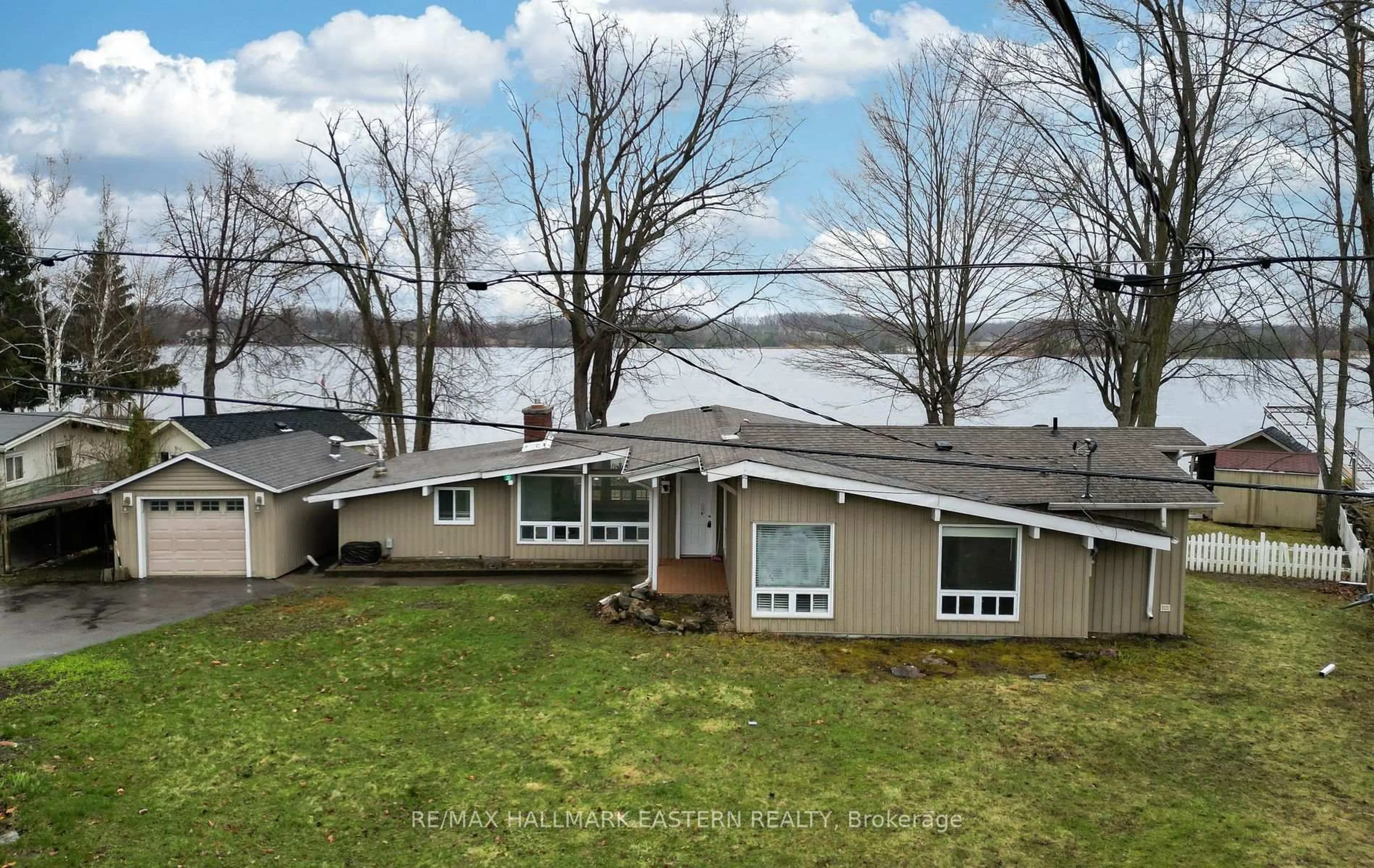 A pic from outside/outdoor area/front of a property/back of a property/a pic from drone, water/lake/river/ocean view for 30 Edgewater Dr, Selwyn Ontario K0L 1T0