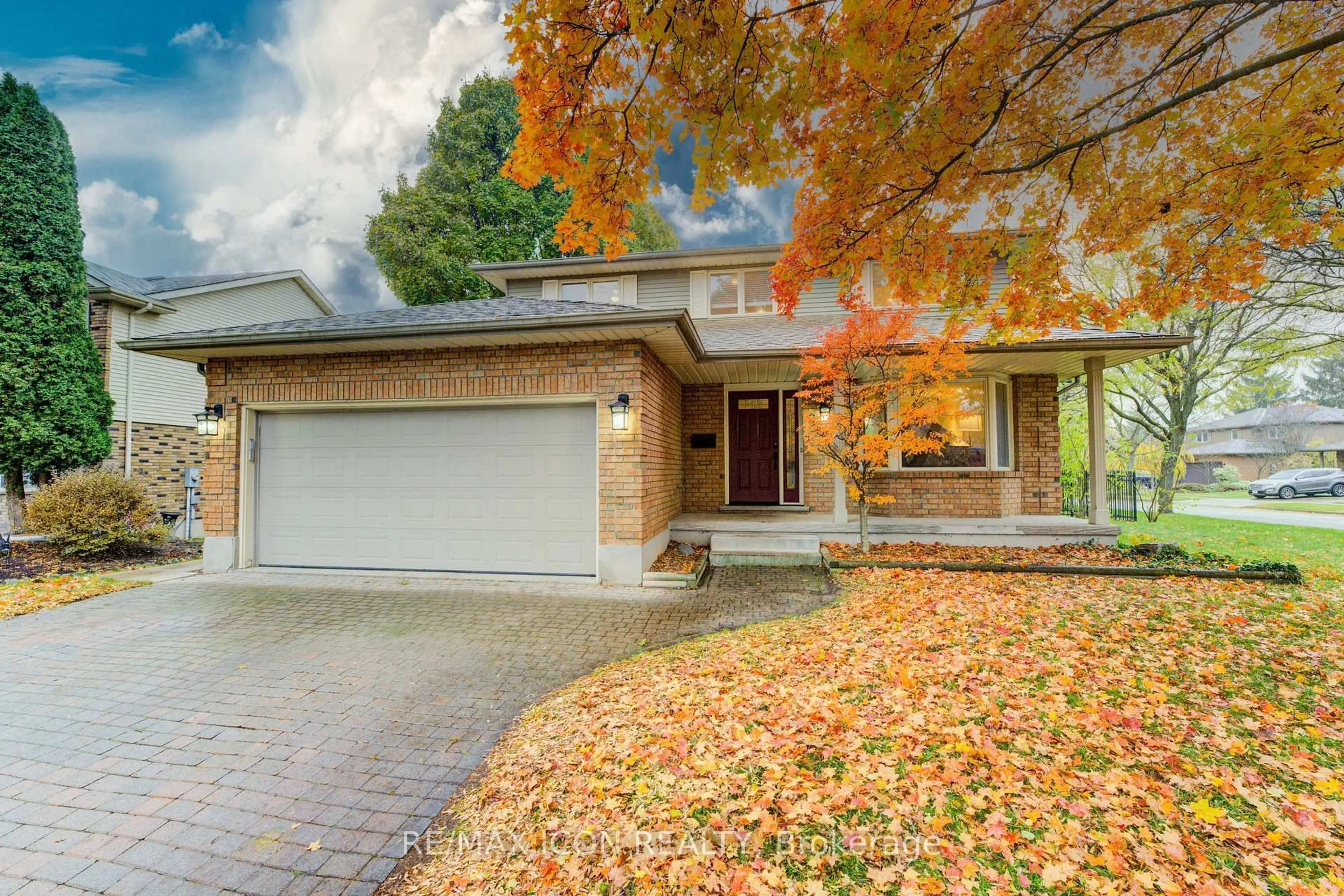 Home with brick exterior material, street for 2 Dunnington Crt, Kitchener Ontario N2A 3M5