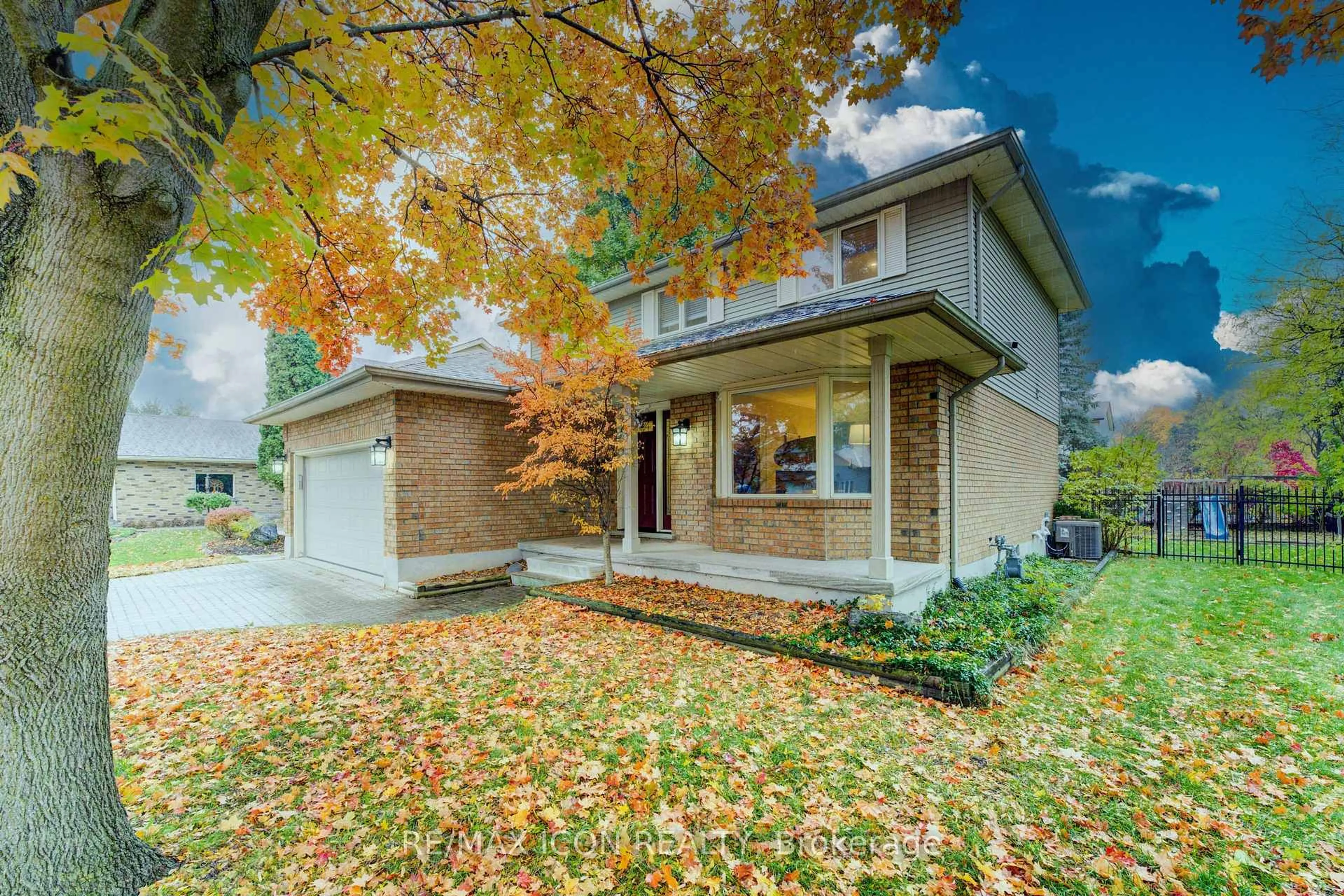 Home with brick exterior material, street for 2 Dunnington Crt, Kitchener Ontario N2A 3M5