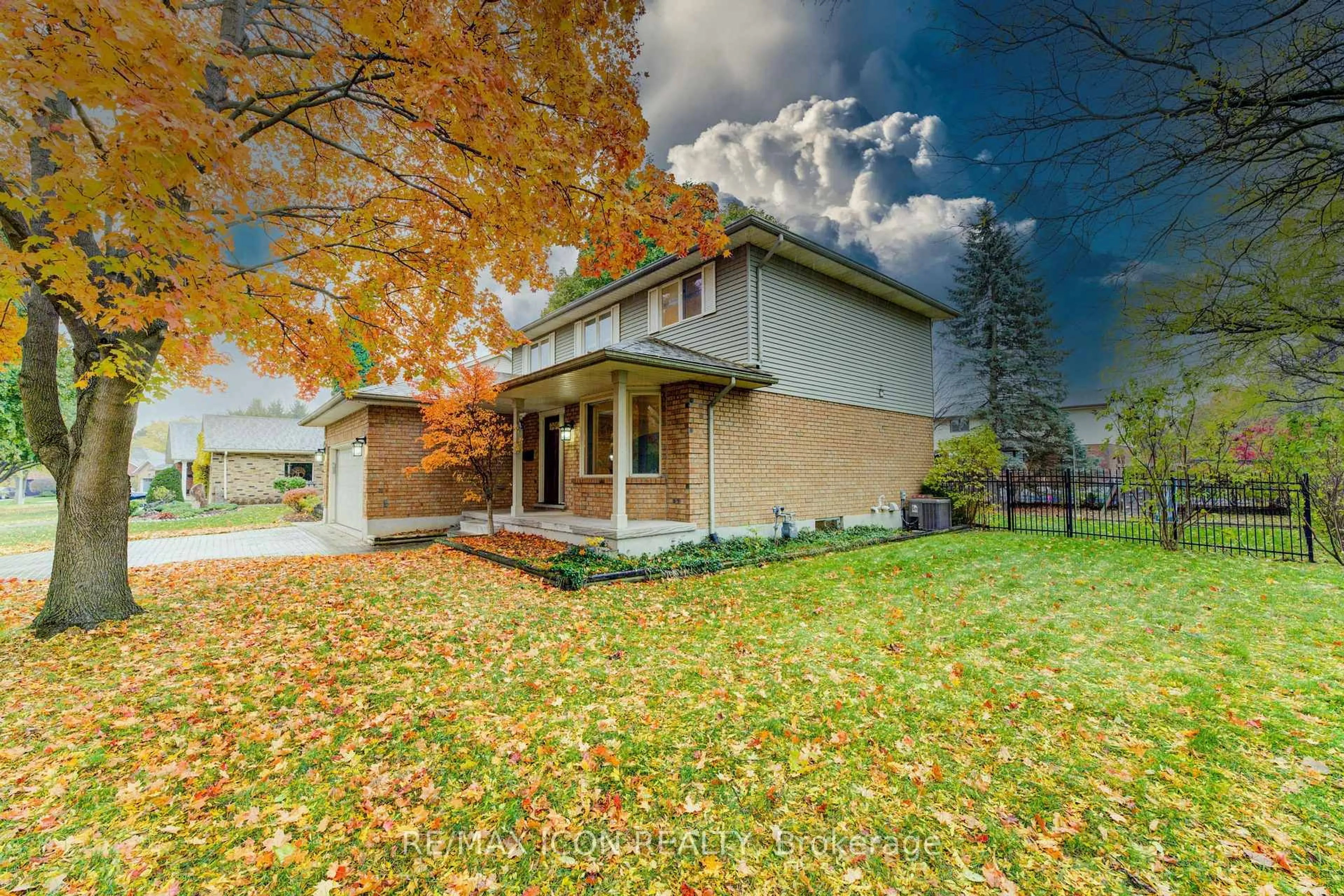 Home with brick exterior material, street for 2 Dunnington Crt, Kitchener Ontario N2A 3M5