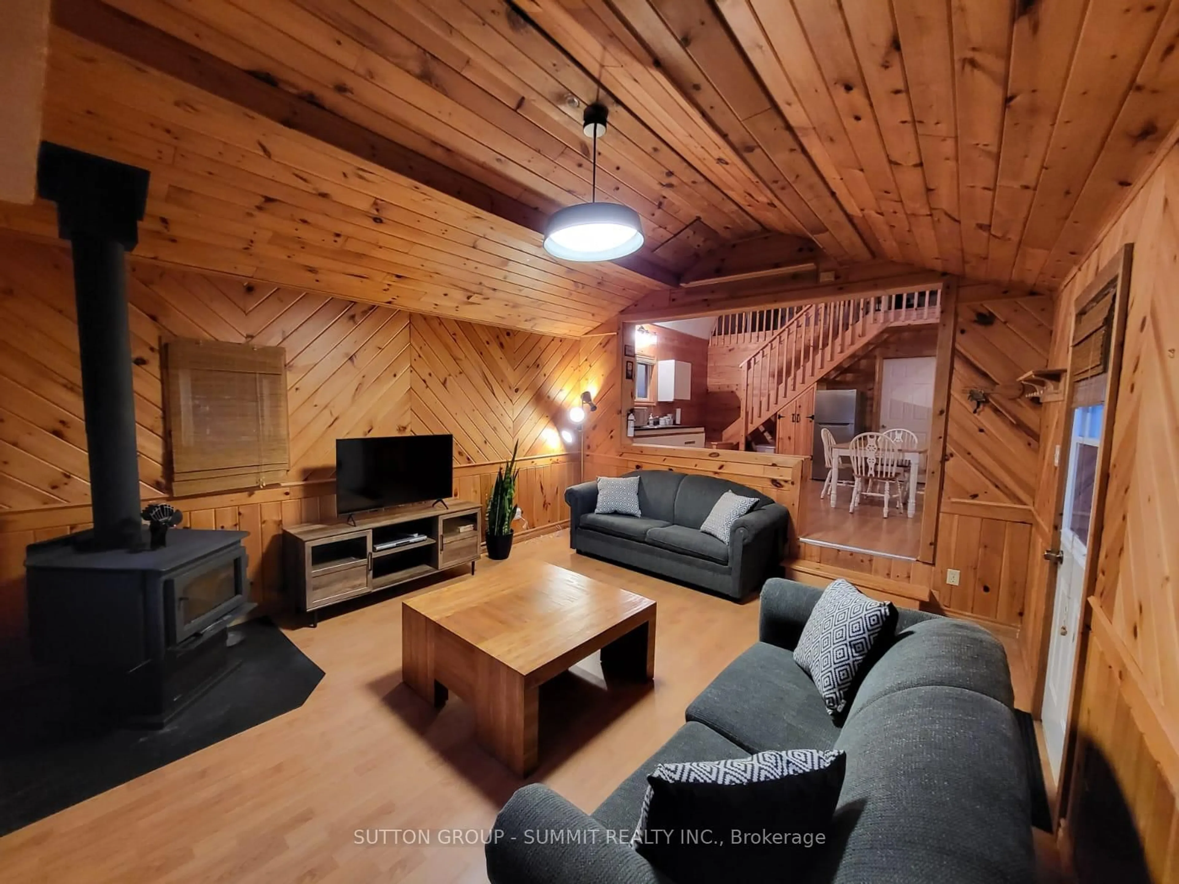 Living room with furniture, wood/laminate floor for 98 West Ham Lake Rd, Killarney Ontario P0M 1A0