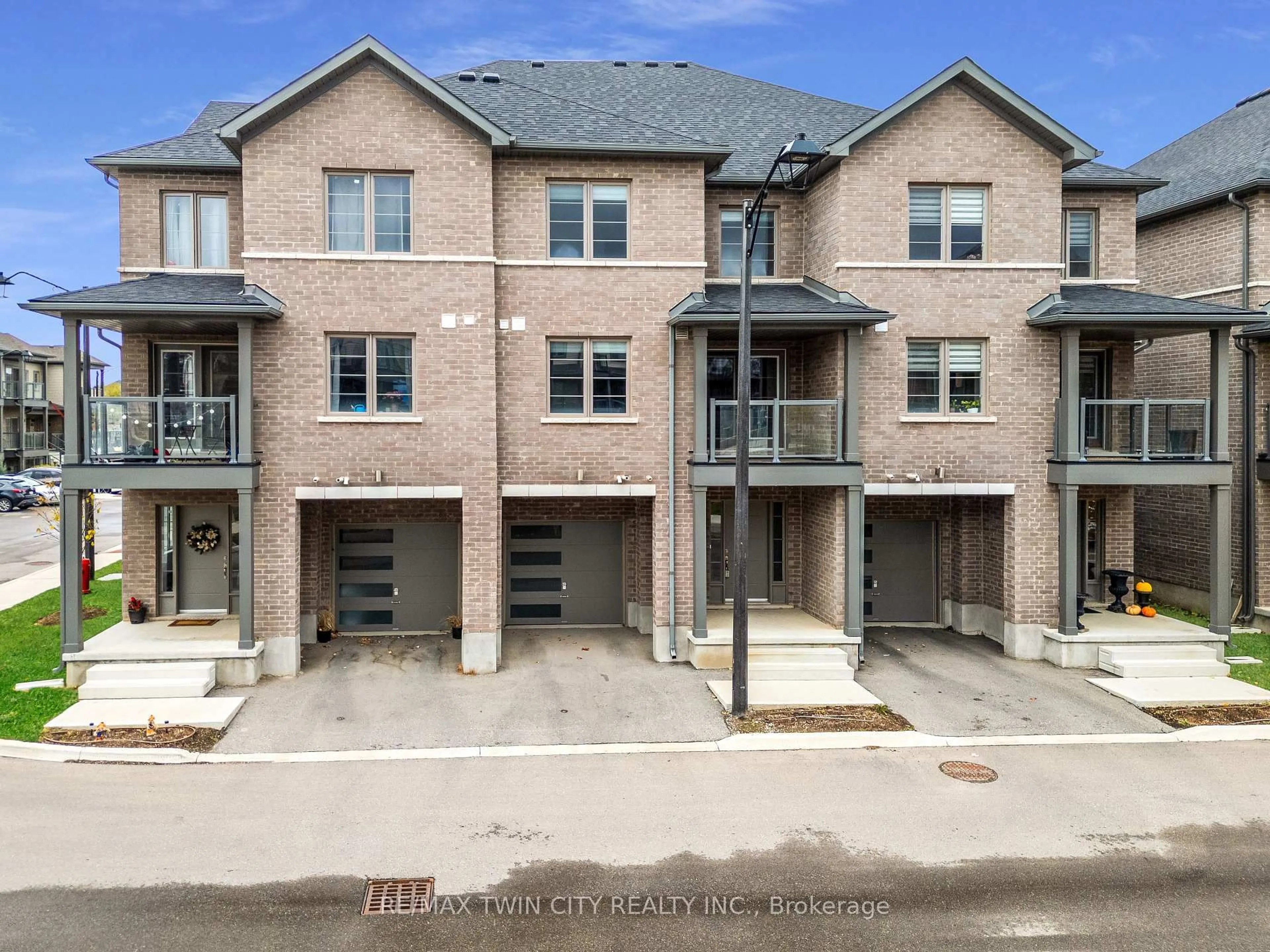 A pic from outside/outdoor area/front of a property/back of a property/a pic from drone, street for 205 West Oak Tr #12, Kitchener Ontario N2R 0R9