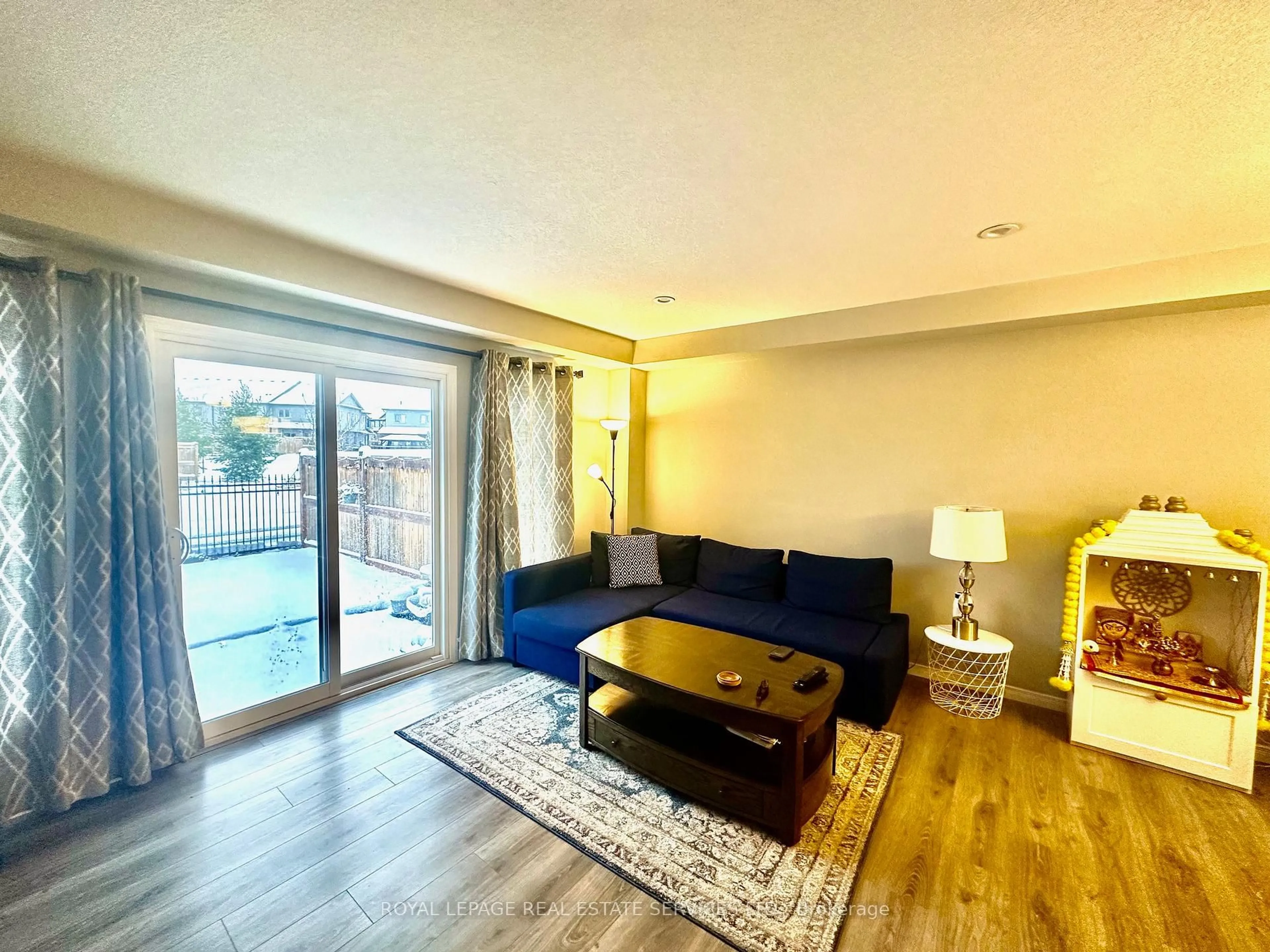 Living room with furniture, wood/laminate floor for 60 Netherwood Rd, Kitchener Ontario L2P 0E4