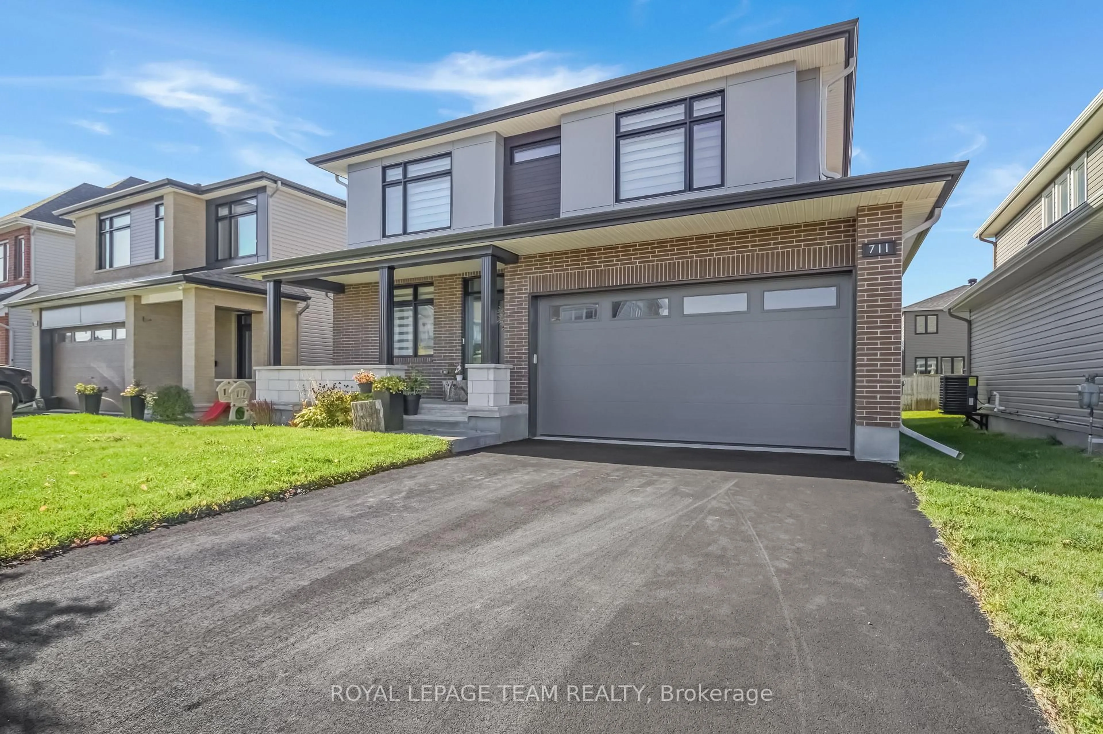 Home with brick exterior material, street for 711 Moonflower Cres, Ottawa Ontario K1T 0X8