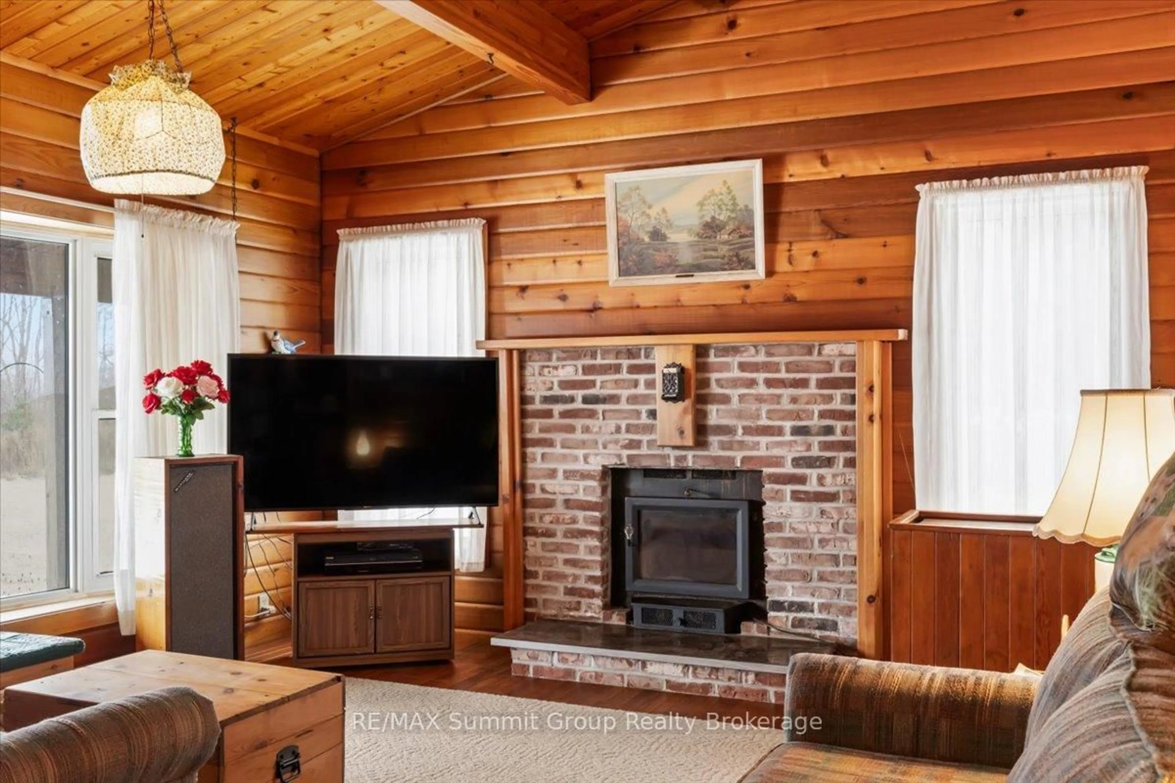 Living room with furniture, wood/laminate floor for 263733 Southgate Road 26, Southgate Ontario N0G 1R0