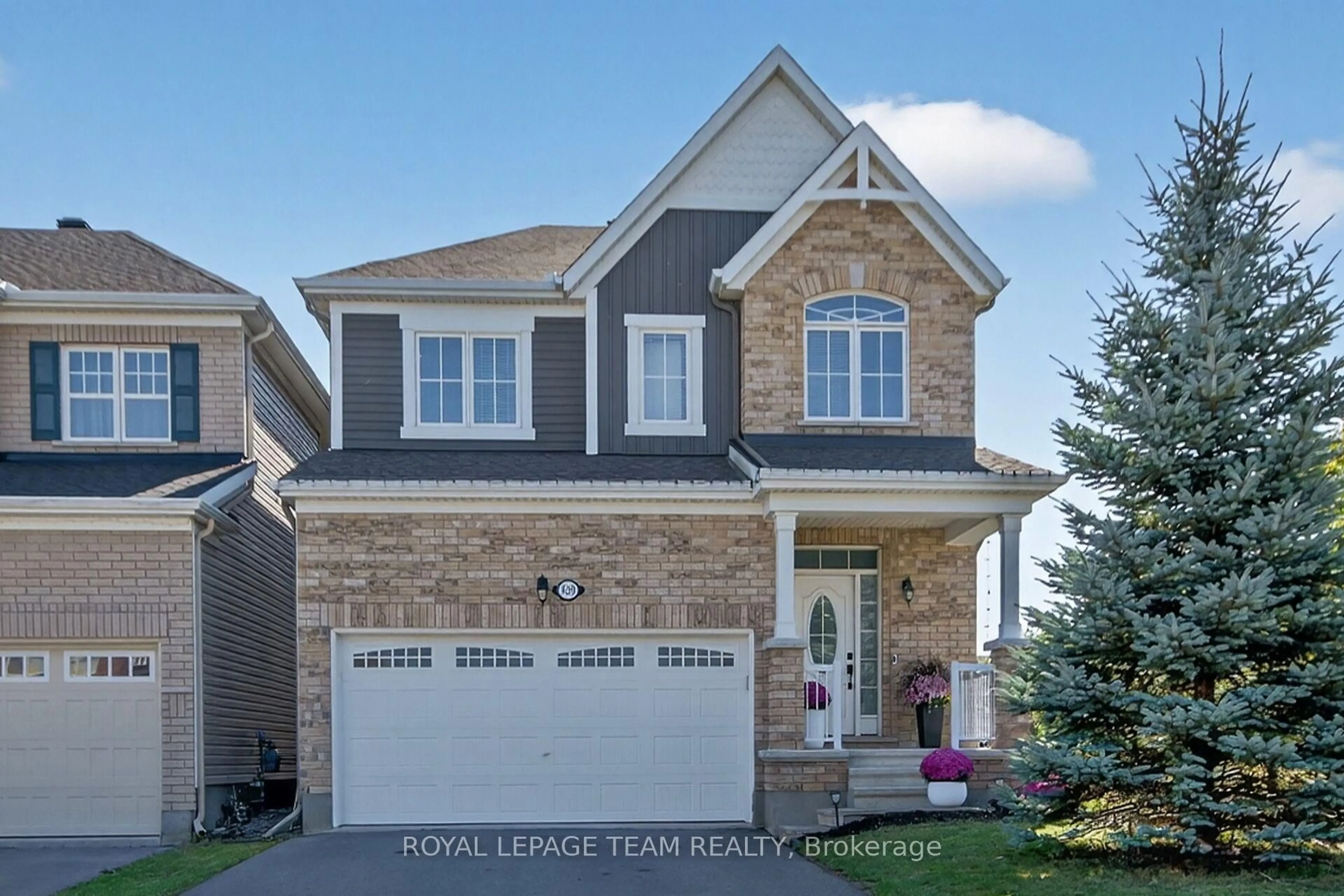 Home with brick exterior material, street for 939 Whimbrel Way, Ottawa Ontario K2J 6C5