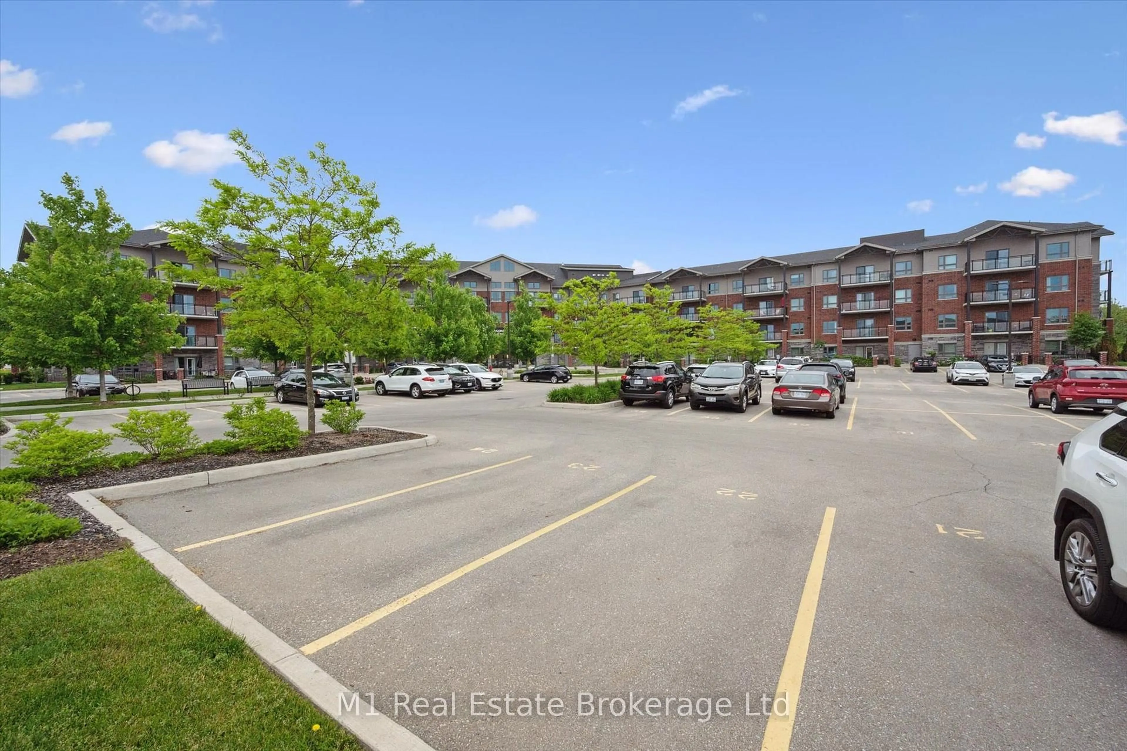 A pic from outside/outdoor area/front of a property/back of a property/a pic from drone, street for 35 Kingsbury Sq #215, Guelph Ontario N1L 1B3