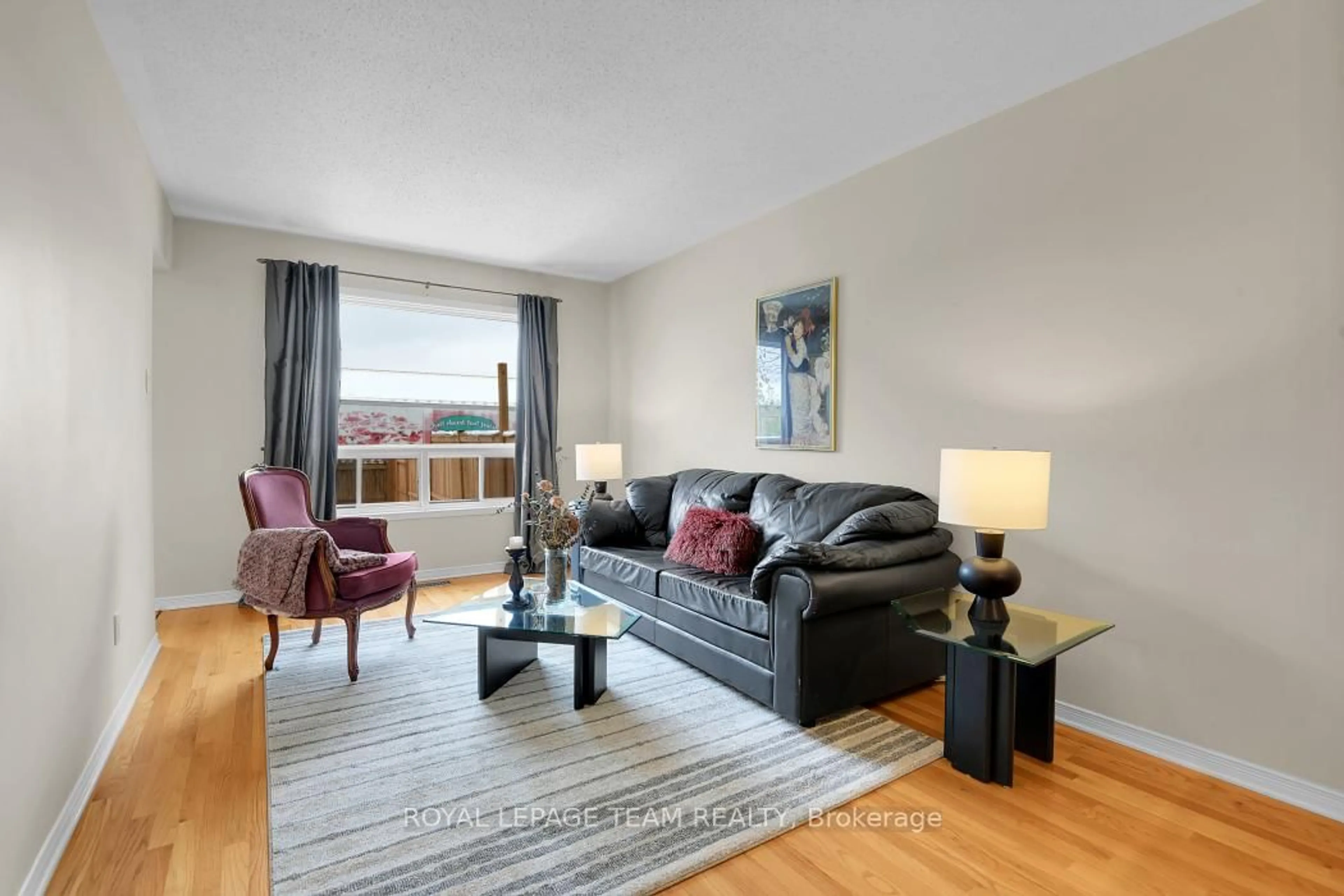 Living room with furniture, wood/laminate floor for 1584 Cedar Mills Rd, Orleans Ontario K1C 7M1