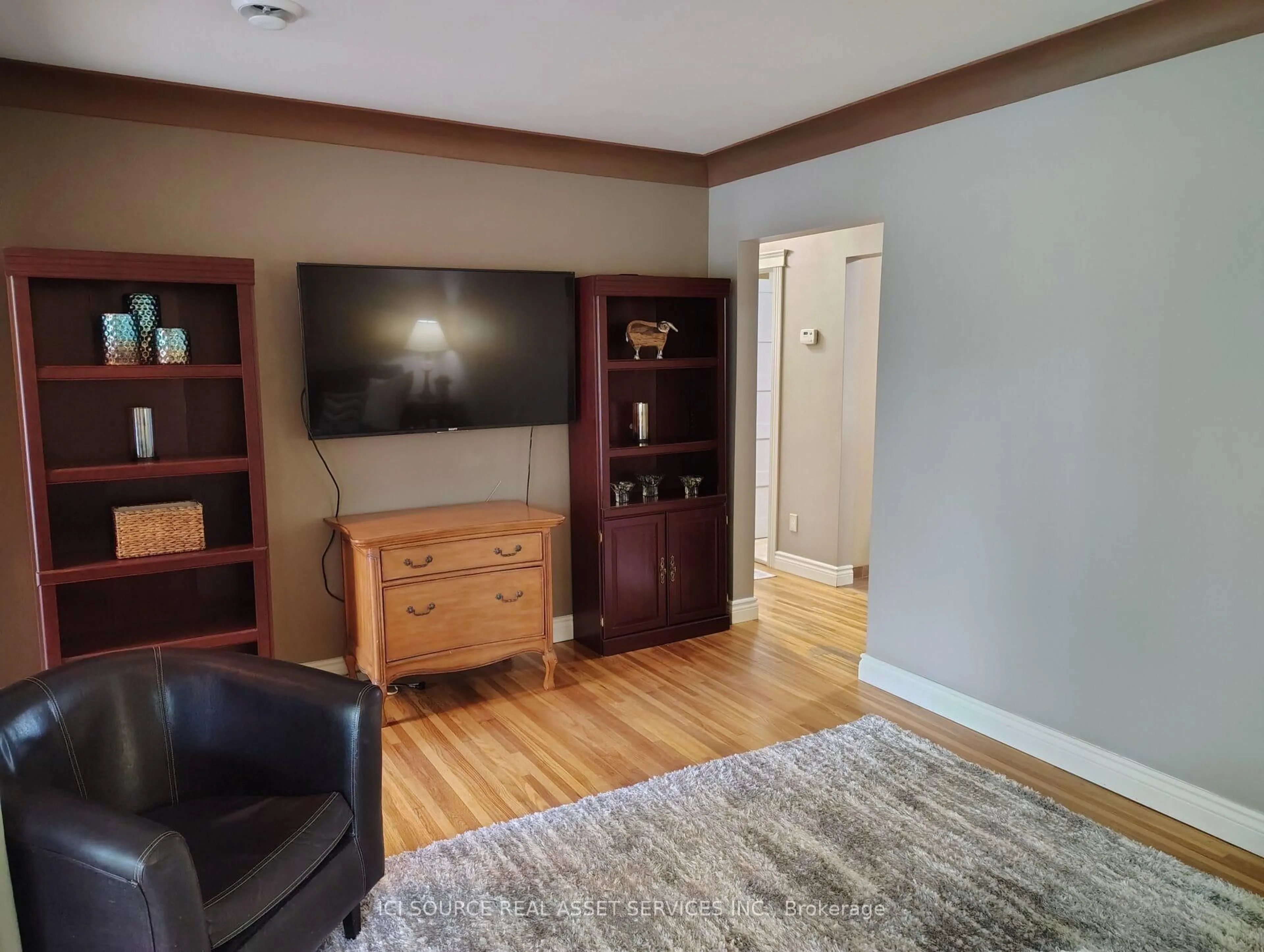 Living room with furniture, wood/laminate floor for 8581 Jerome St, Windsor Ontario N8S 1W8