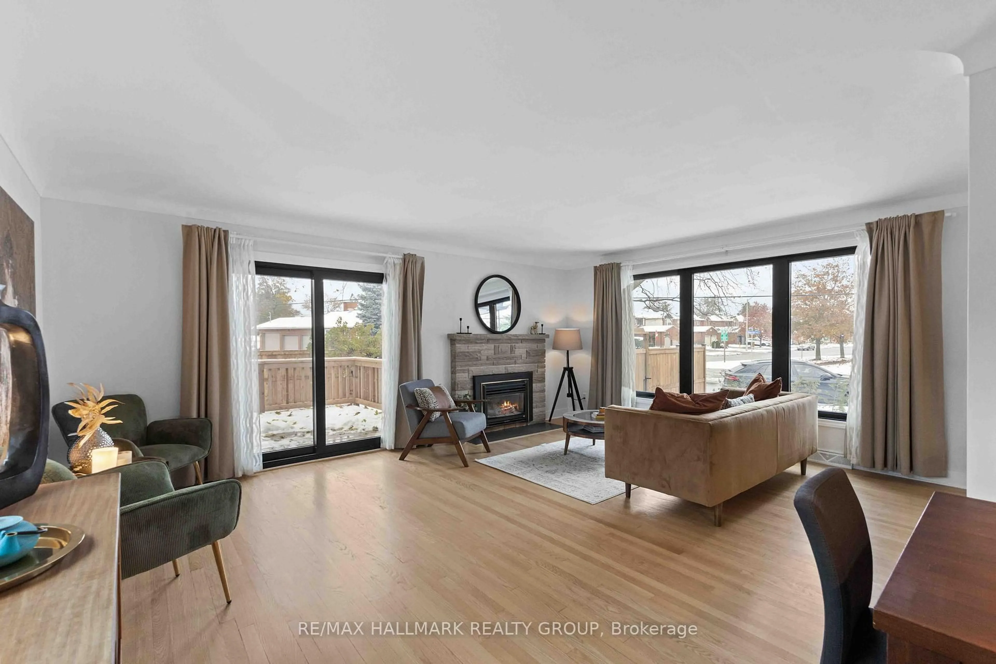 Living room with furniture, wood/laminate floor for 2186 Lenester Ave, Ottawa Ontario K2A 1L4