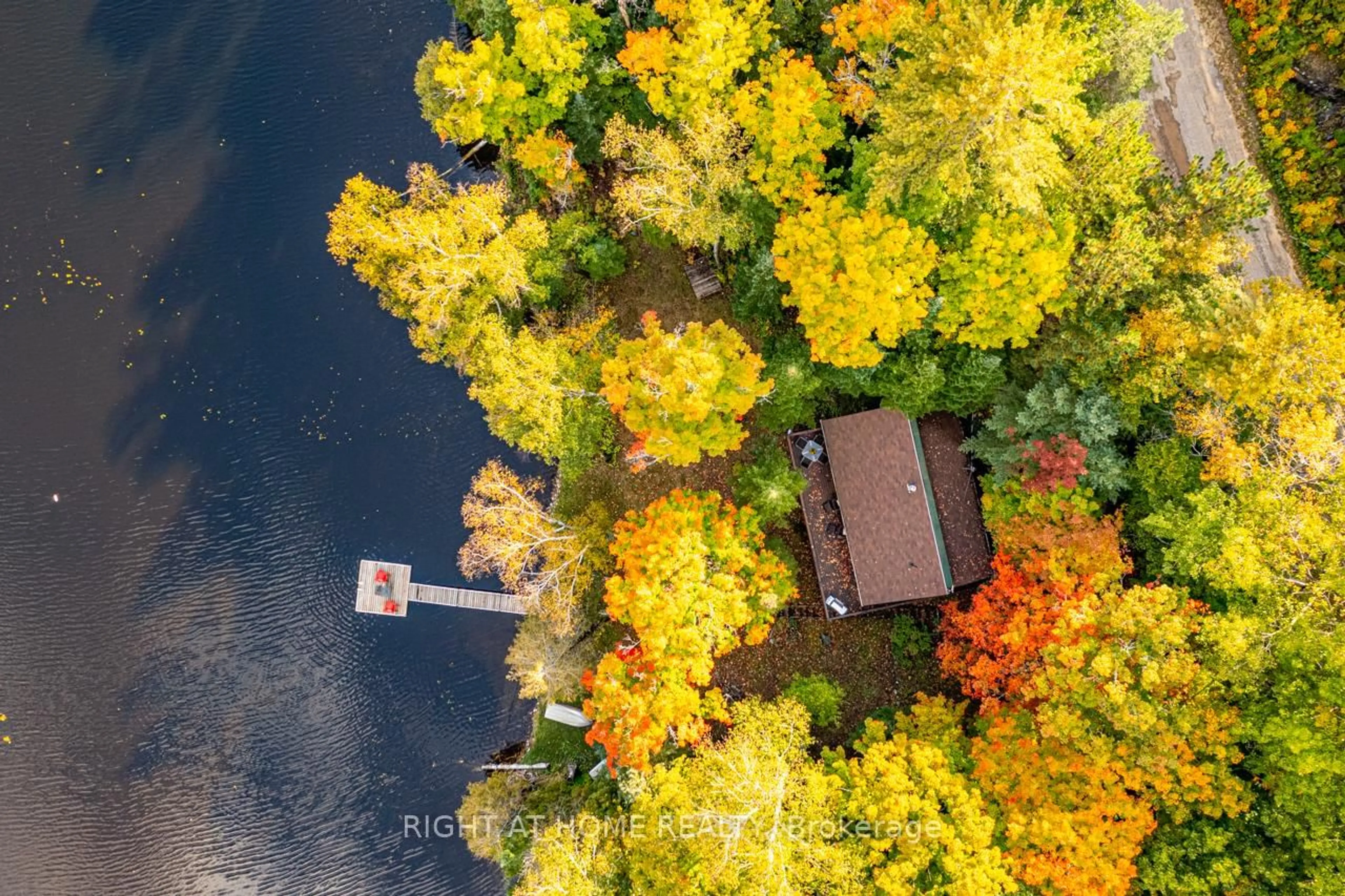 A pic from outside/outdoor area/front of a property/back of a property/a pic from drone, water/lake/river/ocean view for 1220 Portage Lake Rd, Dysart et al Ontario K0M 1S0