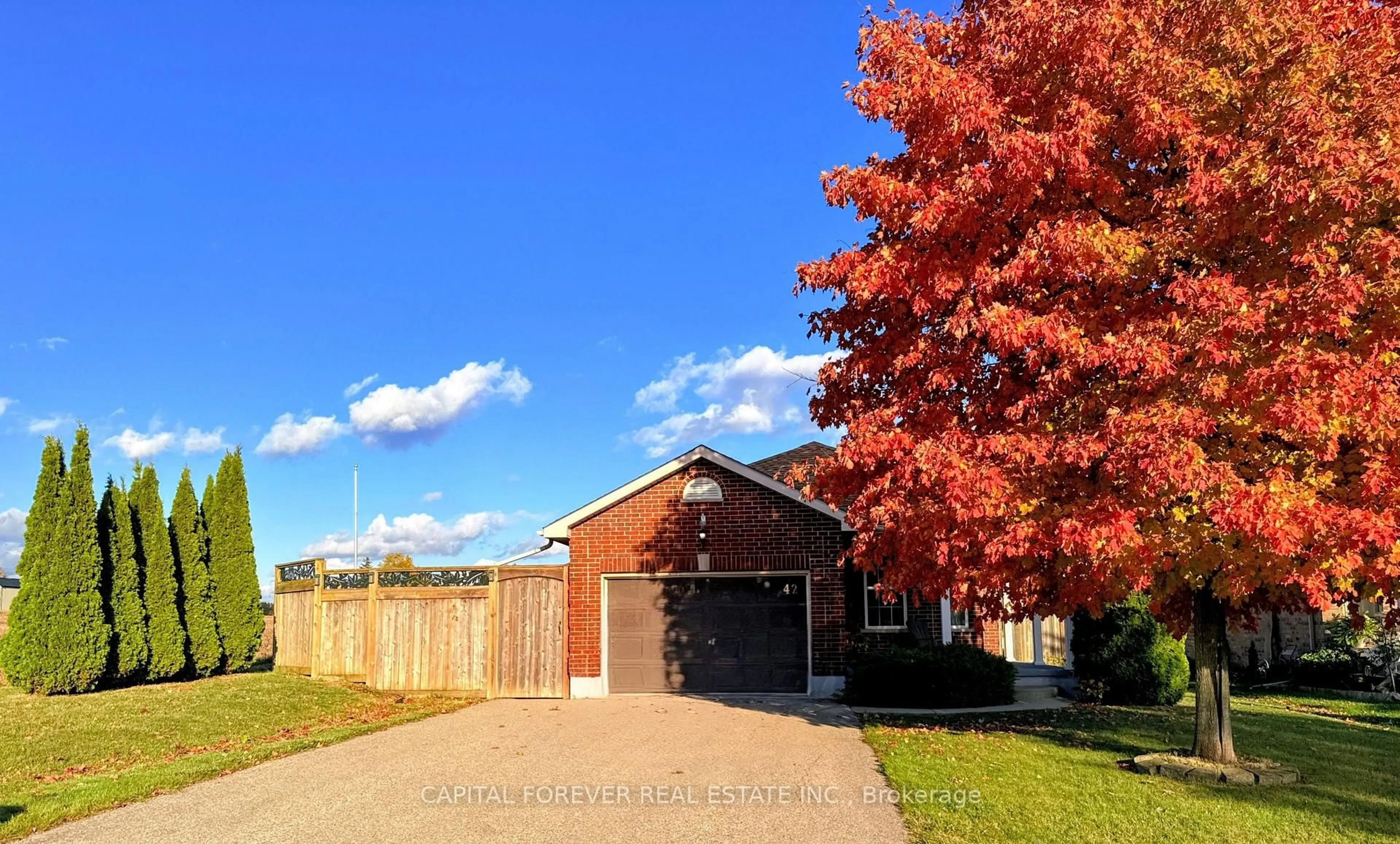 Home with brick exterior material, street for 42 Dogwood Dr, Tillsonburg Ontario N4G 5S7