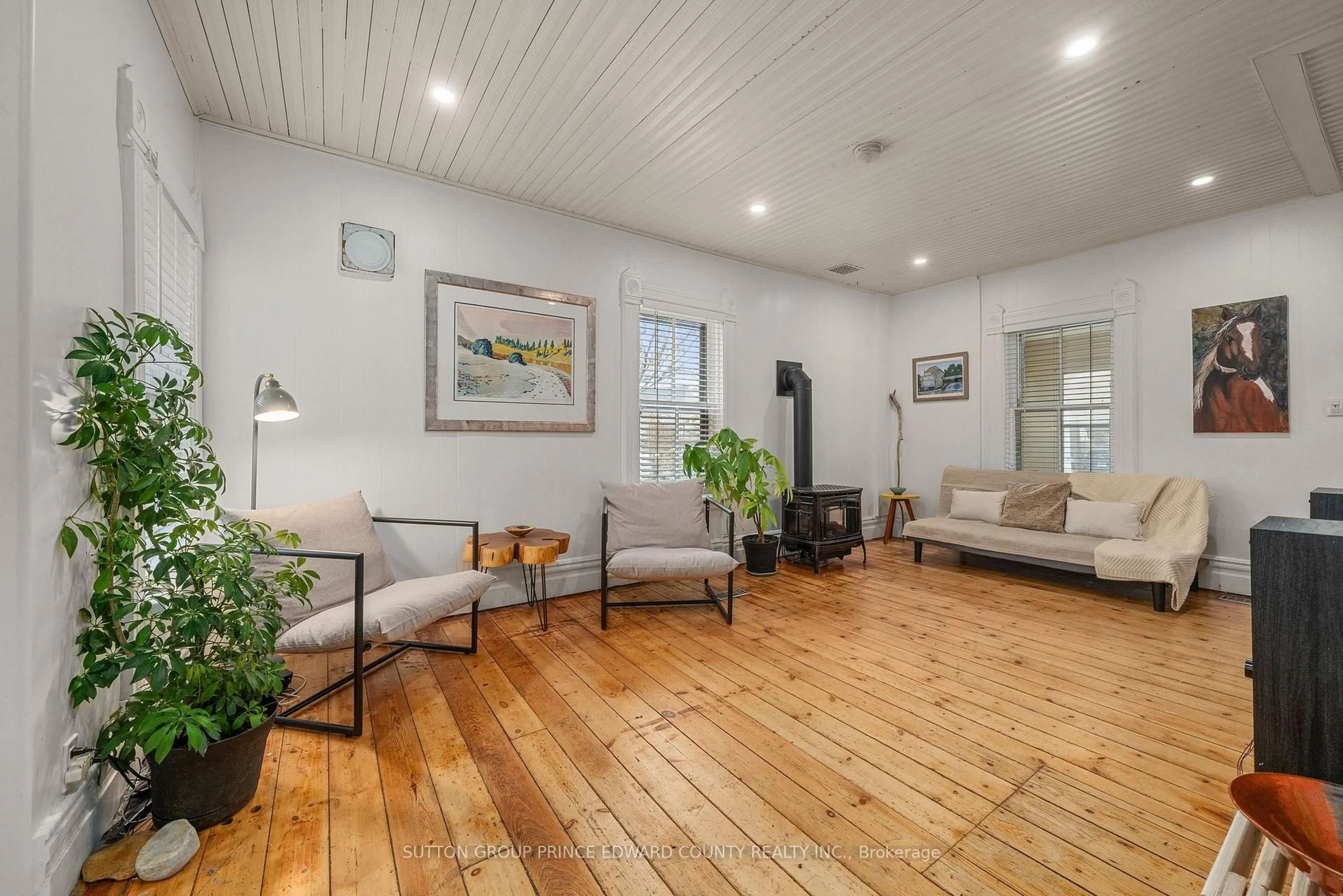 Living room with furniture, wood/laminate floor for 2 Queen St, Prince Edward County Ontario K0K 2T0