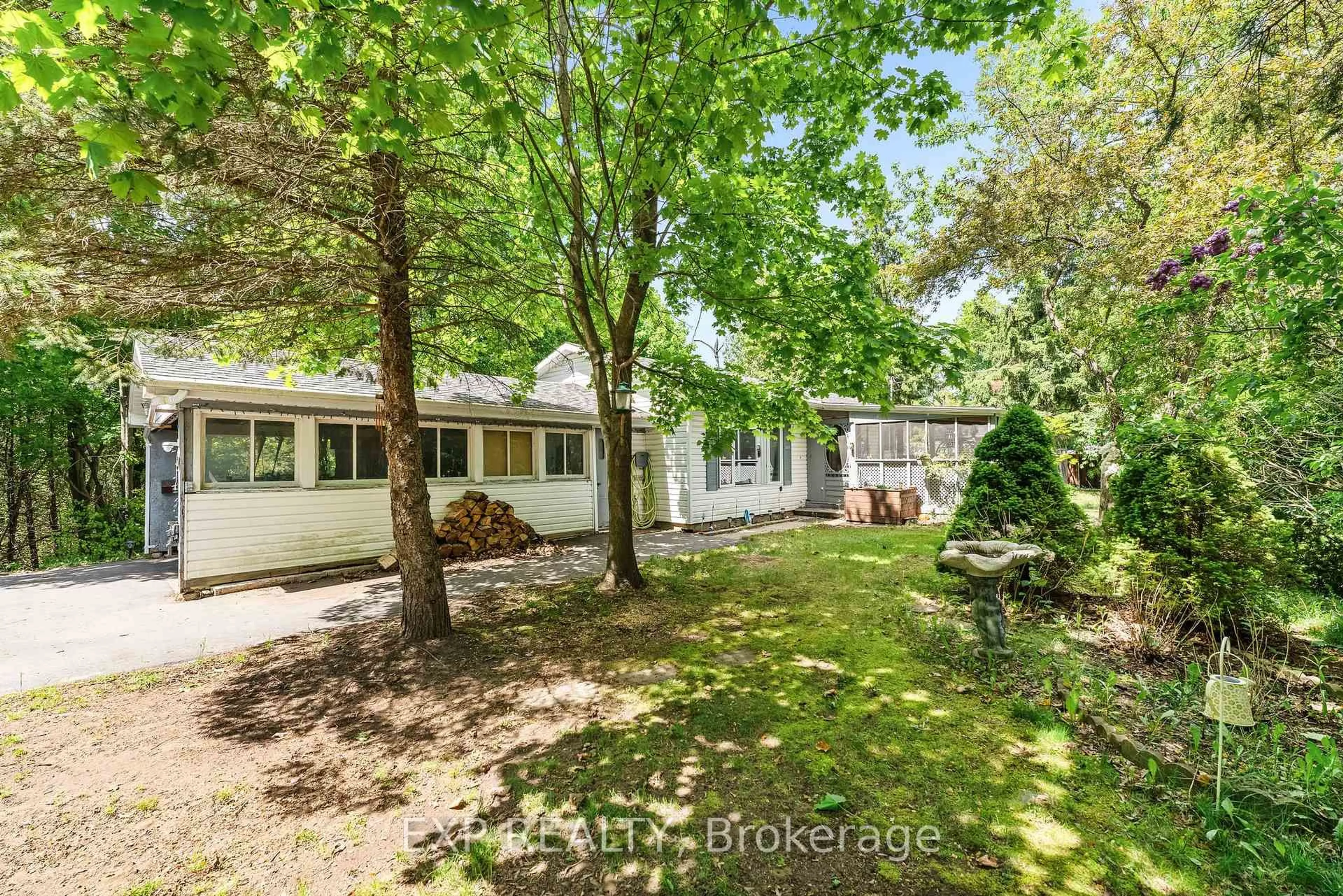 A pic from outside/outdoor area/front of a property/back of a property/a pic from drone, forest/trees view for 4558 County Road 45, Hamilton Township Ontario K9A 4J9