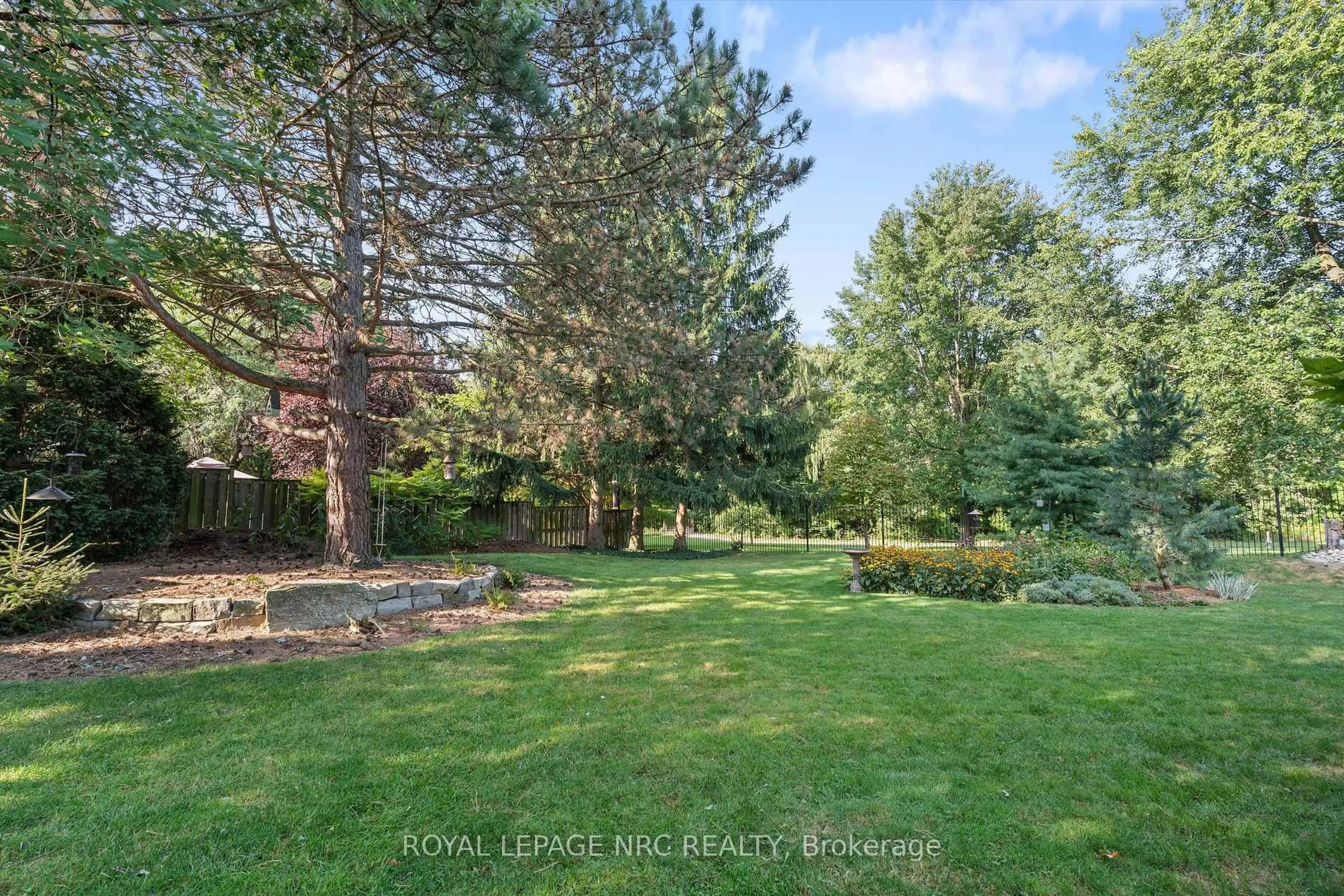 A pic from outside/outdoor area/front of a property/back of a property/a pic from drone, forest/trees view for 42 The Cedars, St. Catharines Ontario L2M 6M8