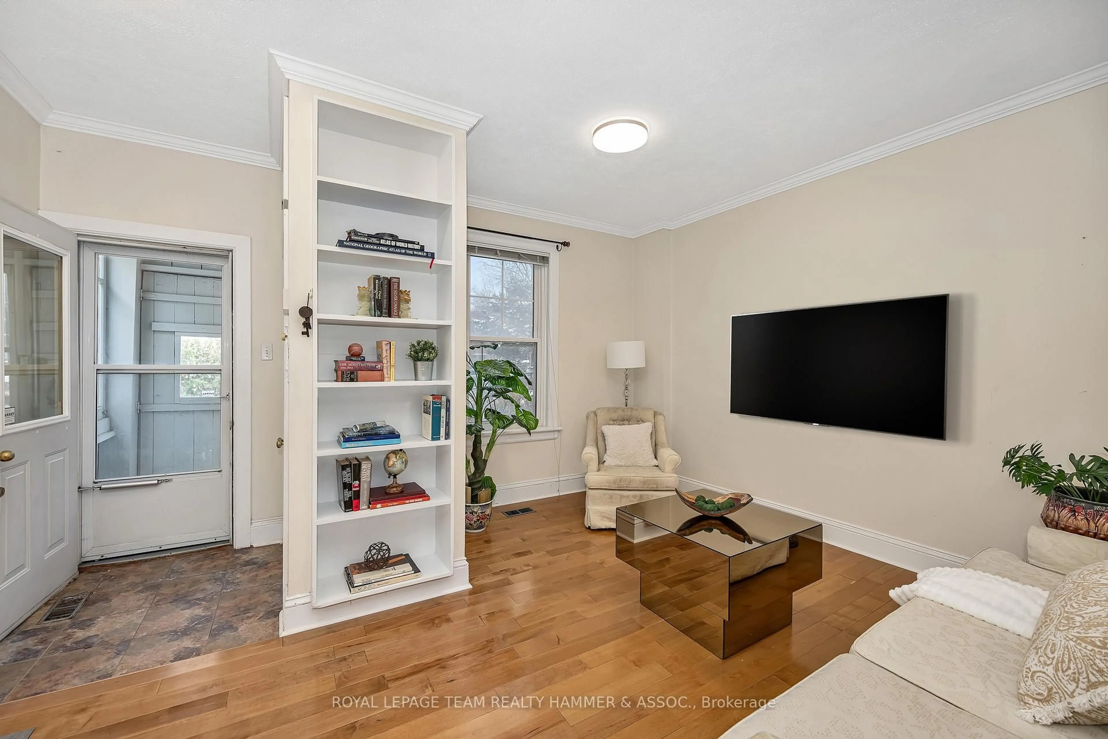 Living room with furniture, wood/laminate floor for 681 1/2 Cooper St, Ottawa Ontario K1R 5J3