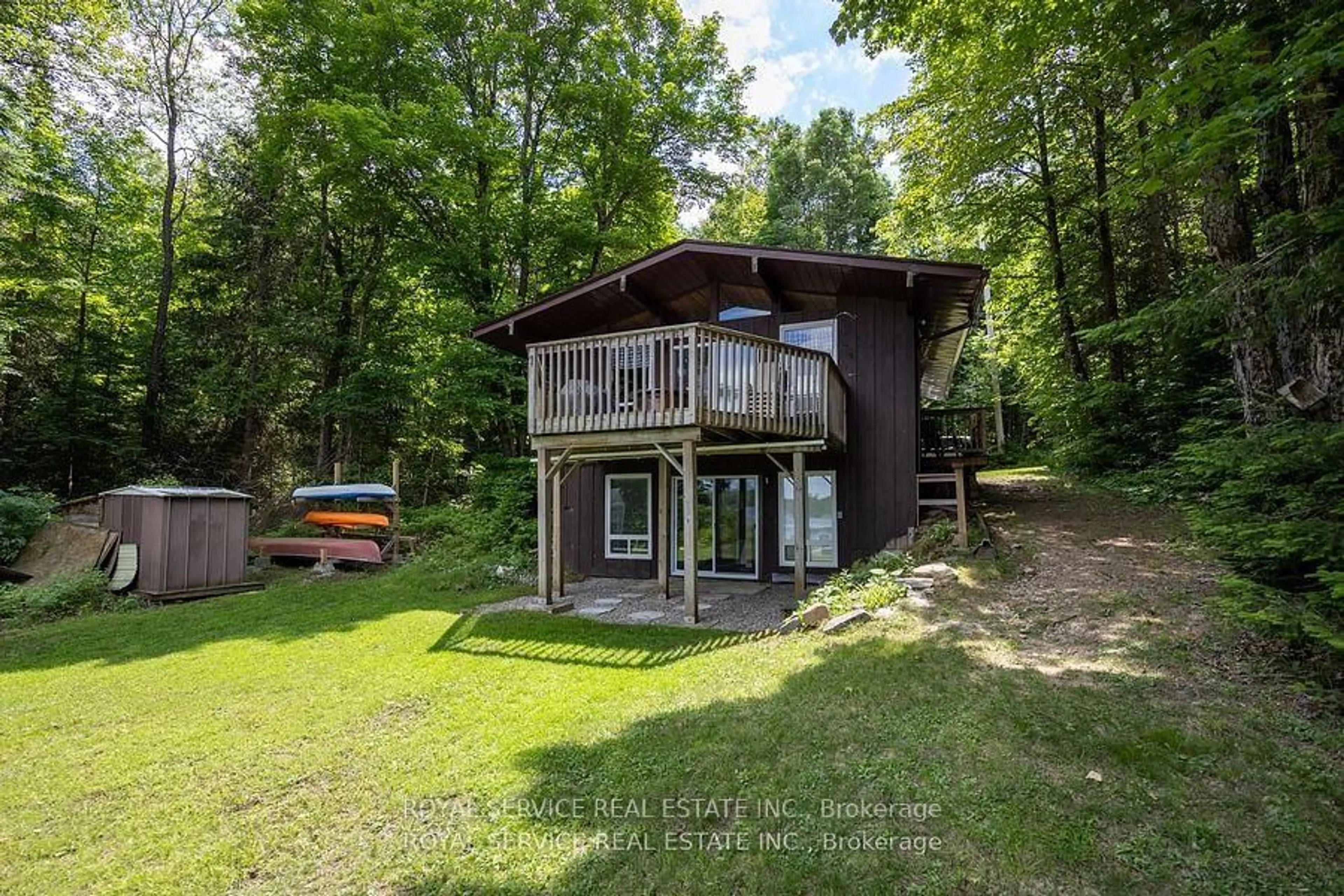 A pic from outside/outdoor area/front of a property/back of a property/a pic from drone, water/lake/river/ocean view for 2104 Brady Lake Rd, Minden Hills Ontario K0M 2K0