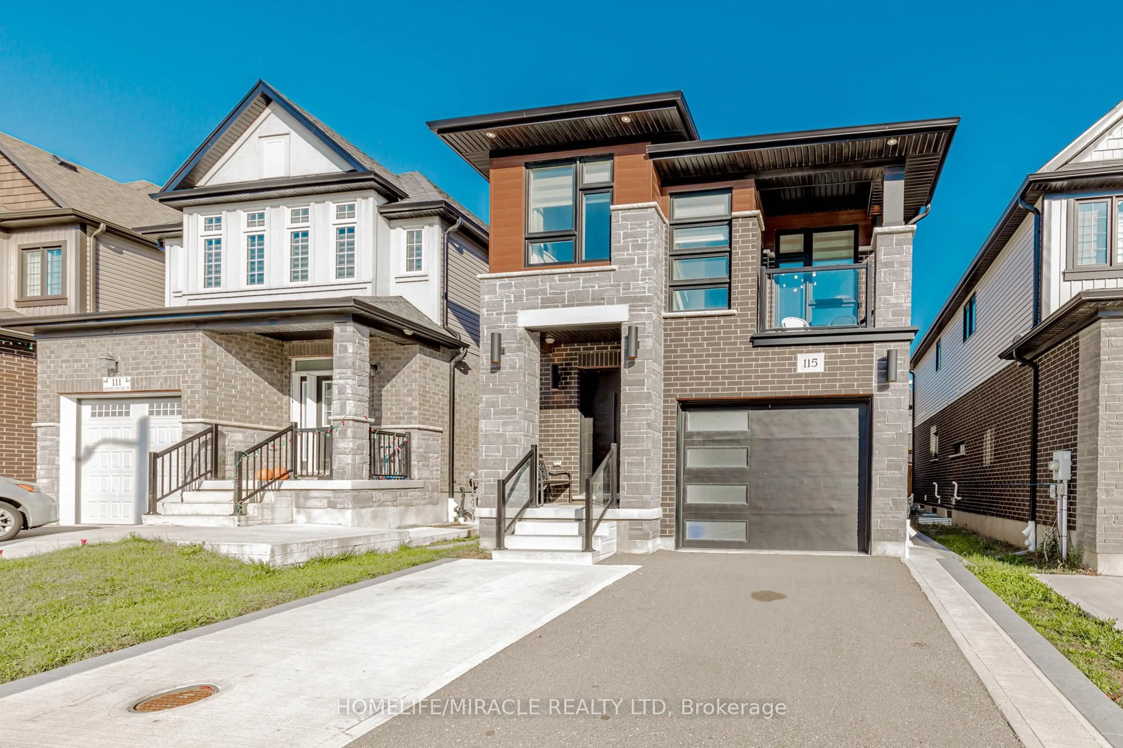 Home with brick exterior material, street for 115 Monarch Woods Dr, Kitchener Ontario N2P 0K2