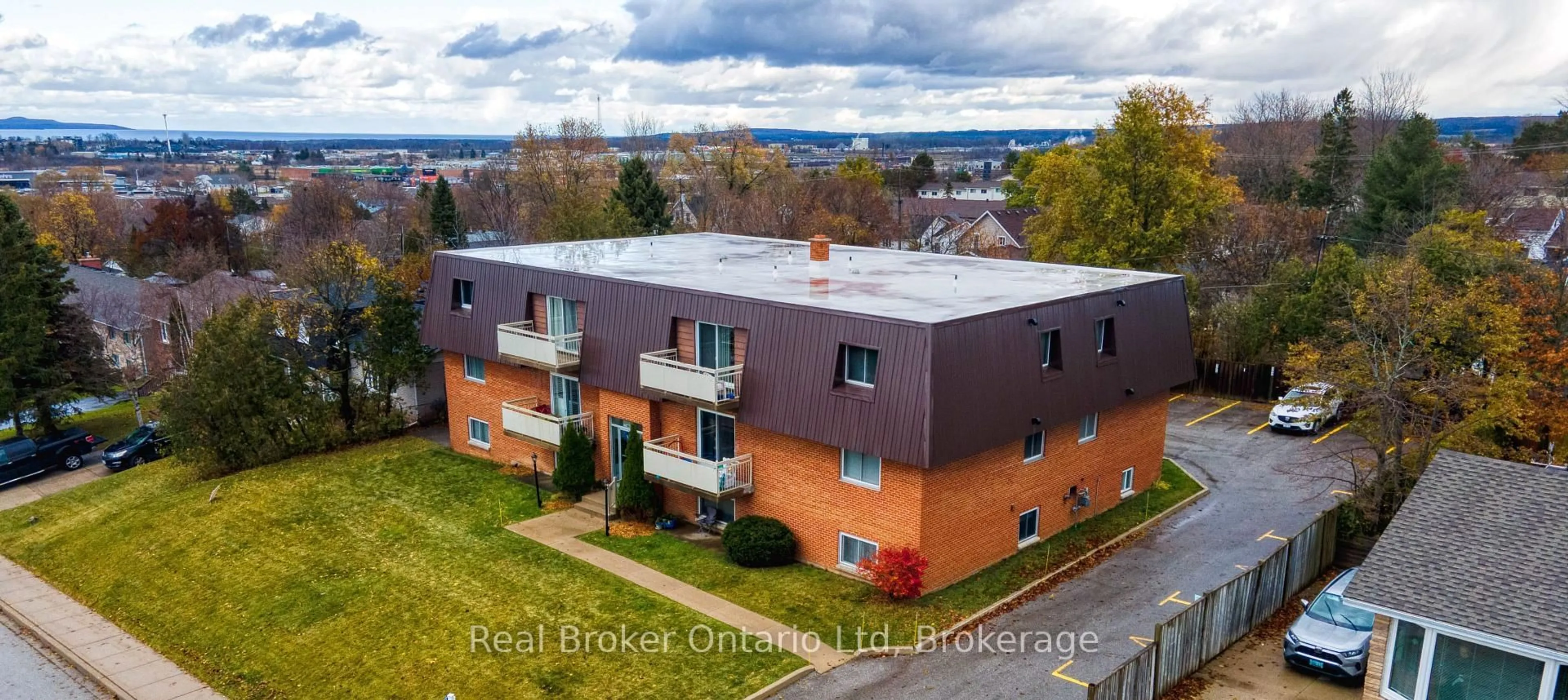 A pic from outside/outdoor area/front of a property/back of a property/a pic from drone, unknown for 925 10th Ave #202, Owen Sound Ontario N4K 3H8