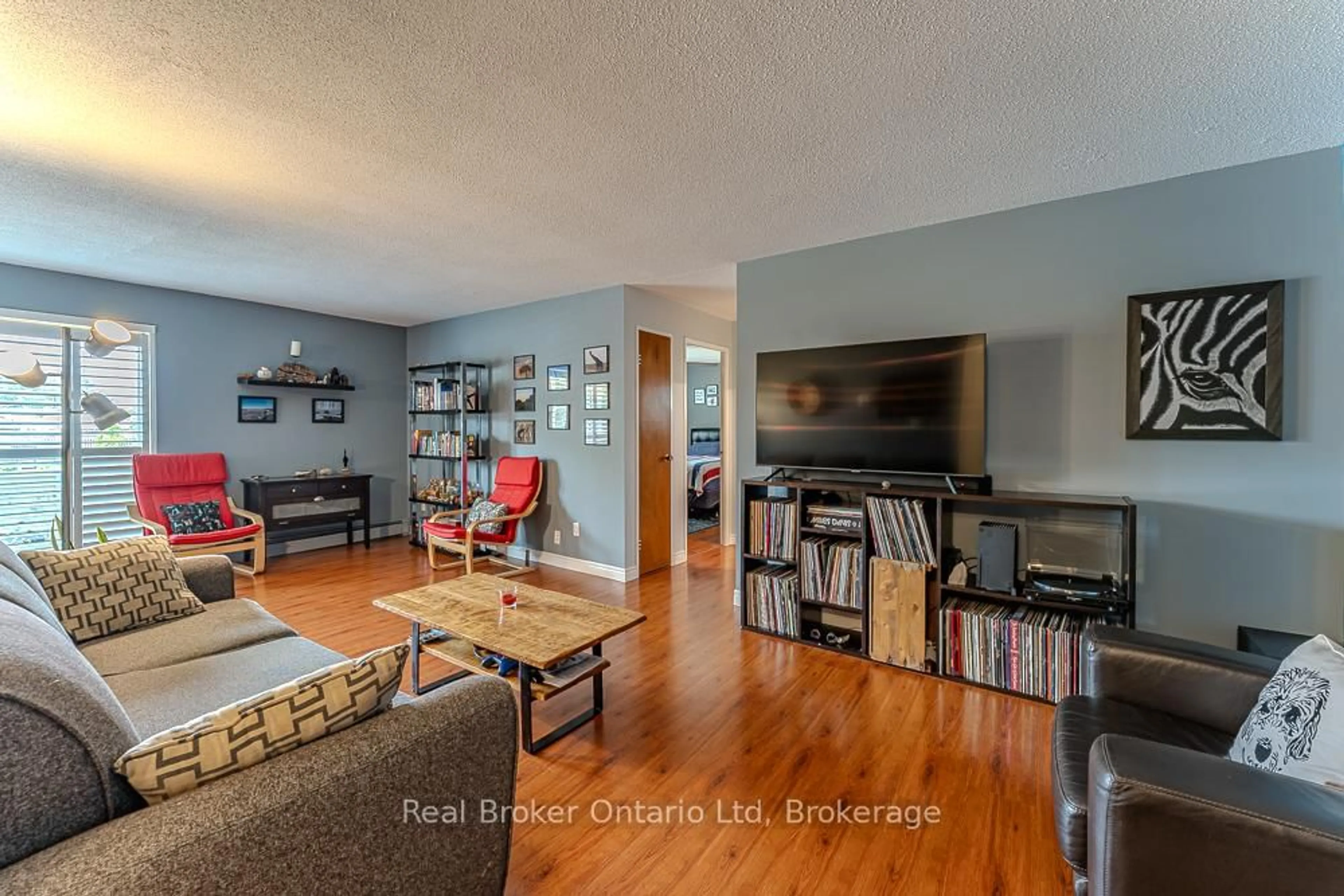 Living room with furniture, wood/laminate floor for 925 10th Ave #202, Owen Sound Ontario N4K 3H8