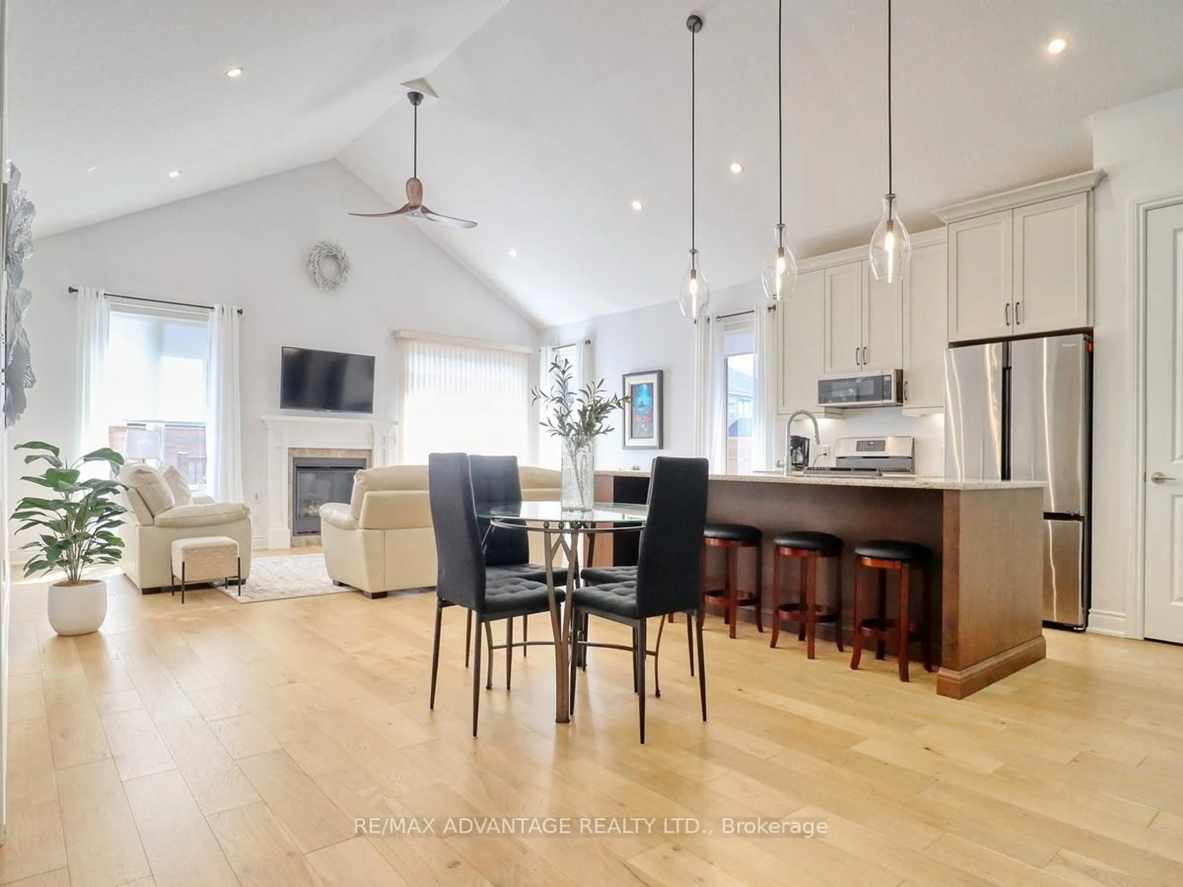 Open concept kitchen, wood/laminate floor for 1891 Trailsway Dr, London South Ontario N6K 0K7