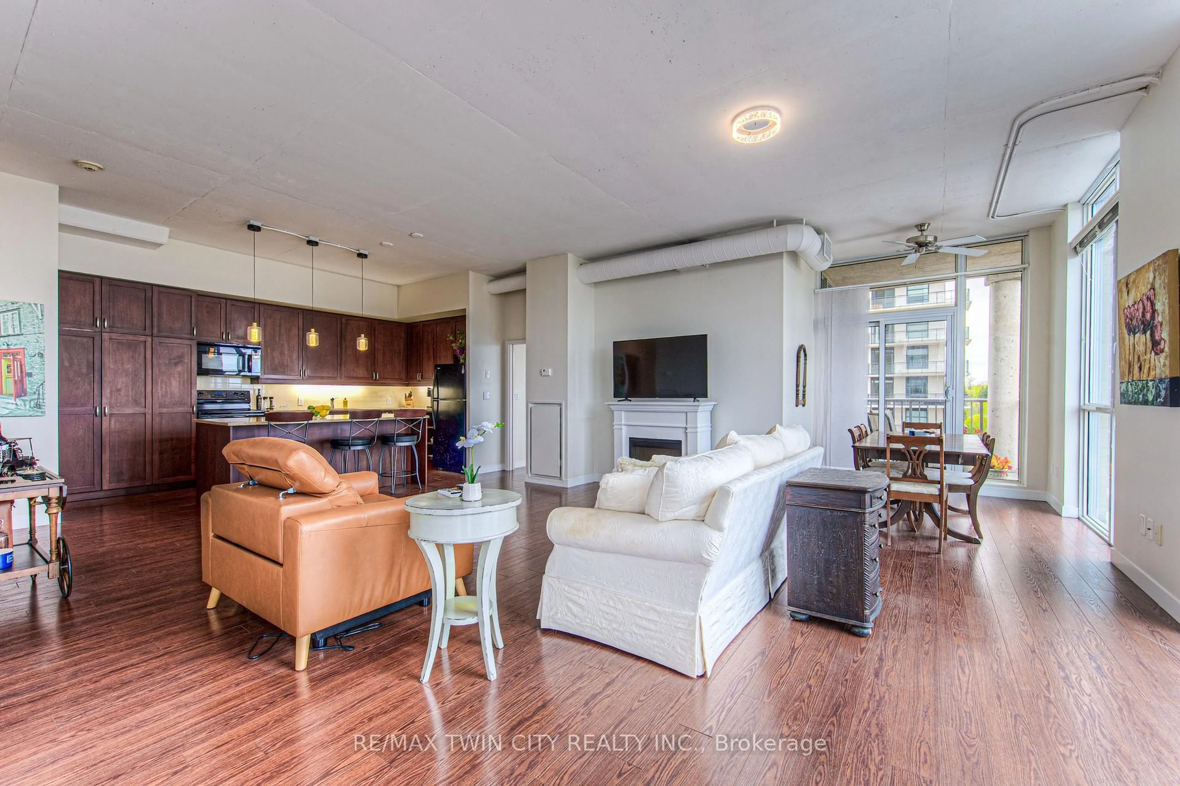 Living room with furniture, wood/laminate floor for 191 KING St #713, Waterloo Ontario N2J 1R1