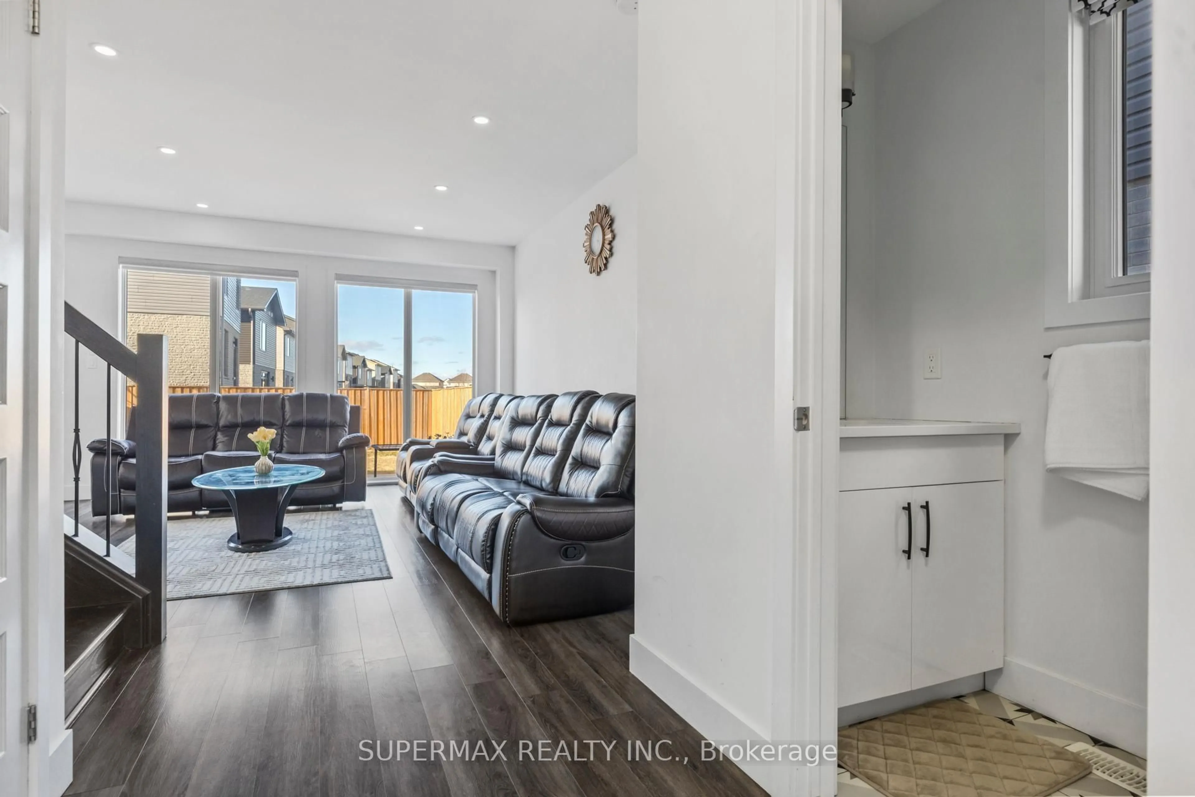 Living room with furniture, wood/laminate floor for 1652 Chelton Crt, London South Ontario N6M 0A2