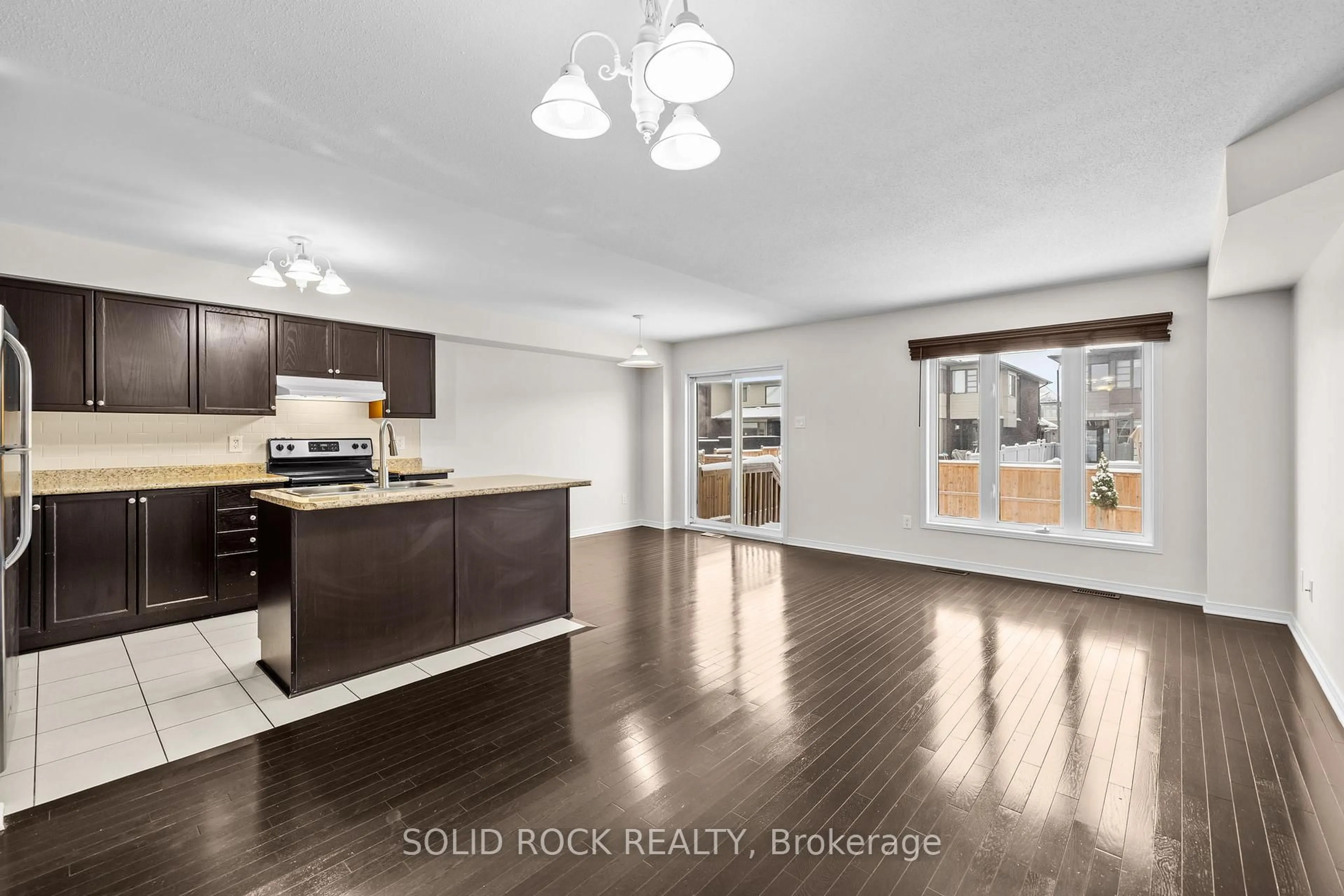 Open concept kitchen, wood/laminate floor for 431 Haresfield Crt, Ottawa Ontario K4M 0B6