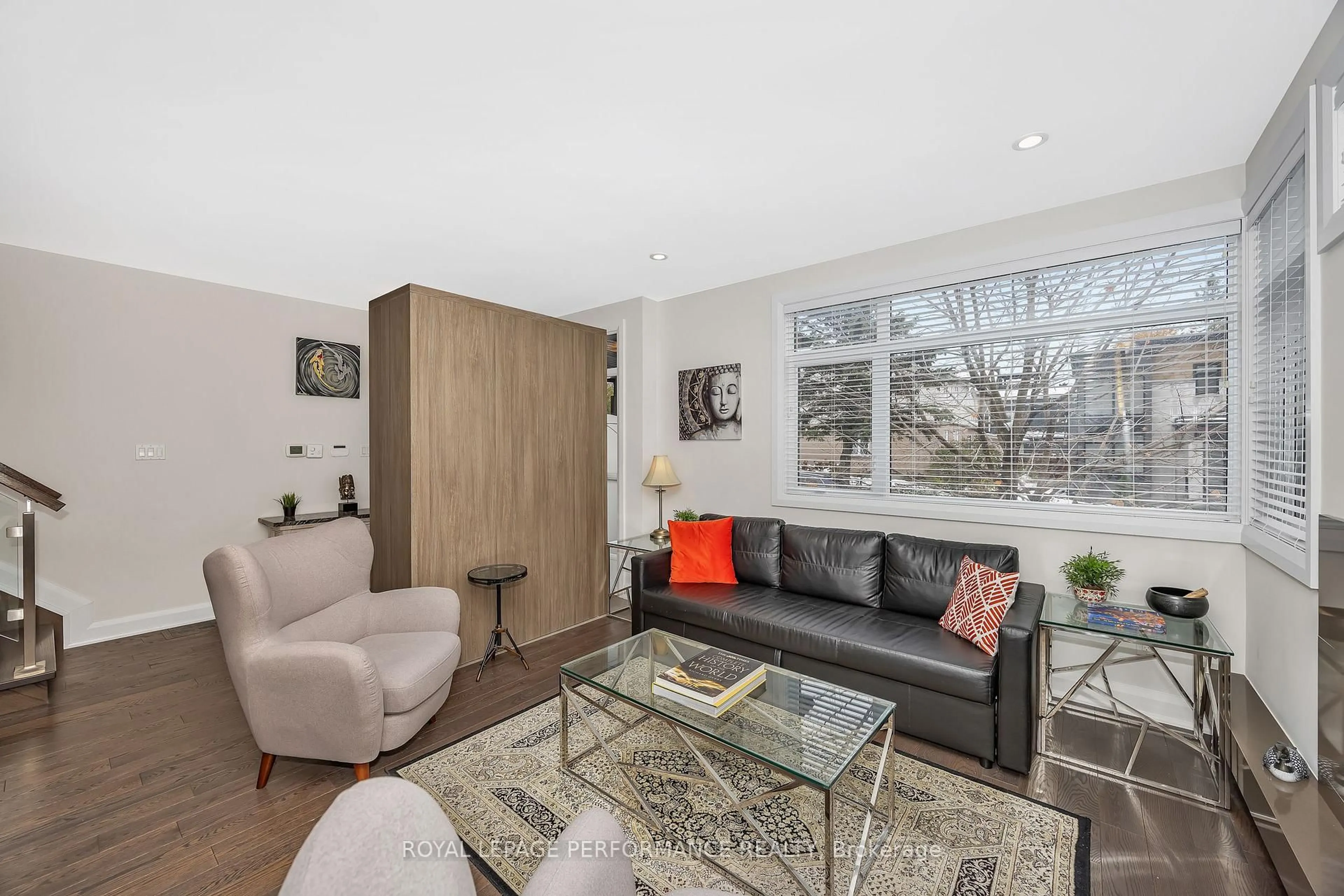 Living room with furniture, wood/laminate floor for 383 Princeton Ave, Ottawa Ontario K2A 4E1