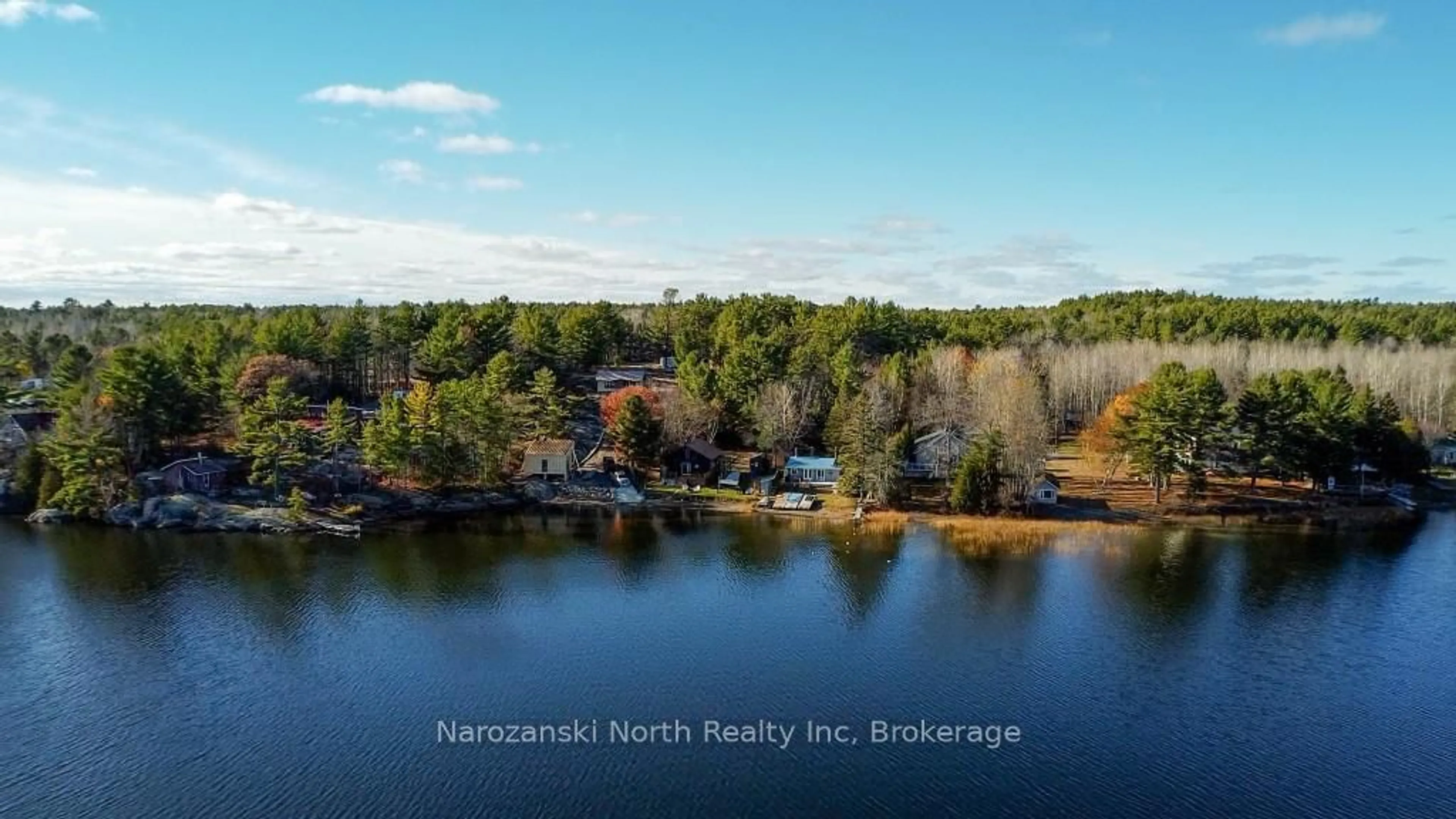 A pic from outside/outdoor area/front of a property/back of a property/a pic from drone, water/lake/river/ocean view for 100 C Whippoorwill Rd, French River Ontario P0M 1A0
